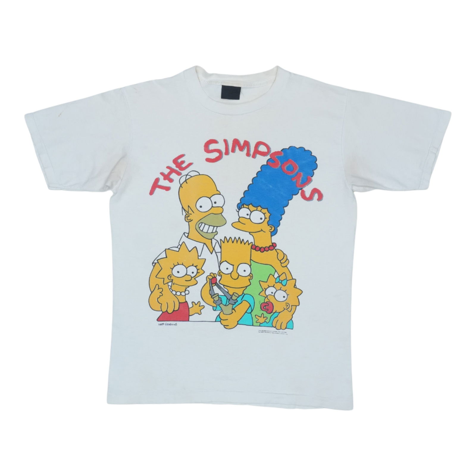 Vintage 1989 The Simpsons White Cotton Shirt: Vintage 1989 The Simpsons White Cotton Shirt Discover a piece of pop culture history with this original vintage 1989 The Simpsons shirt. This authentic shirt showcases the iconic style of the late 80s