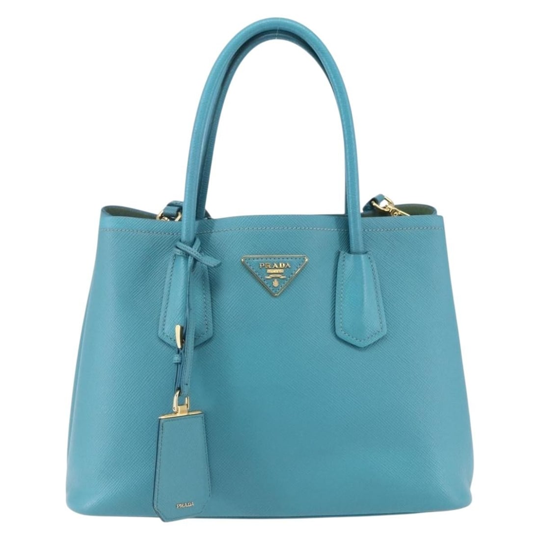 Turquoise Cuir Double Tote Handbag by Prada: Turquoise Cuir Double Tote Handbag by Prada This pre-owned Prada Cuir Double Tote in turquoise is designed for women and crafted to offer both style and functionality. The handbag shows signs of previ