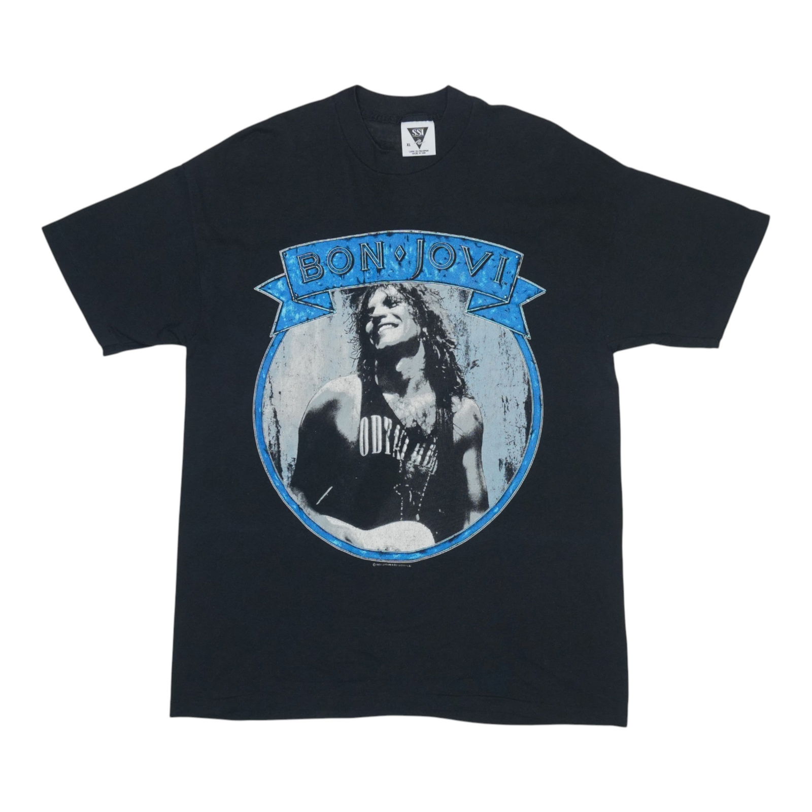 Vintage 1989 Bon Jovi Black Shirt 50/50 Poly Cotton: Vintage 1989 Bon Jovi Black Shirt 50/50 Poly Cotton Discover this original vintage 1989 Bon Jovi shirt, a genuine piece that captures the spirit of the era. This shirt is not a modern reproduction, en