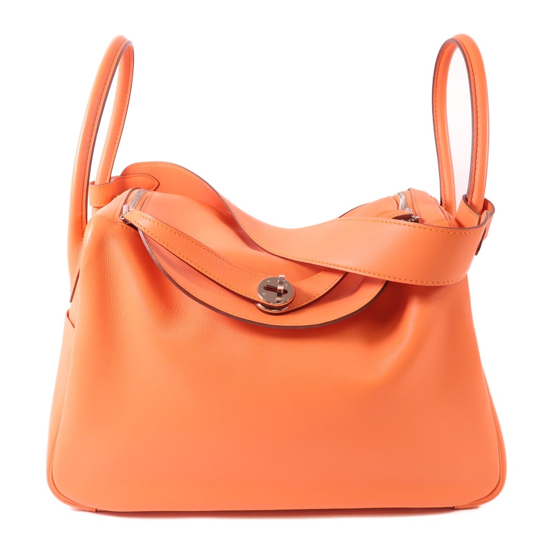 HERMES Lindy 34 2Way Shoulder Hand Bag Veau Swift Leather Orange: HERMES Lindy 34 2Way Shoulder Hand Bag Veau Swift Leather Orange Introducing the HERMES Lindy 34 2Way Shoulder Hand Bag, crafted from luxurious Veau Swift leather. This elegant accessory features a vi