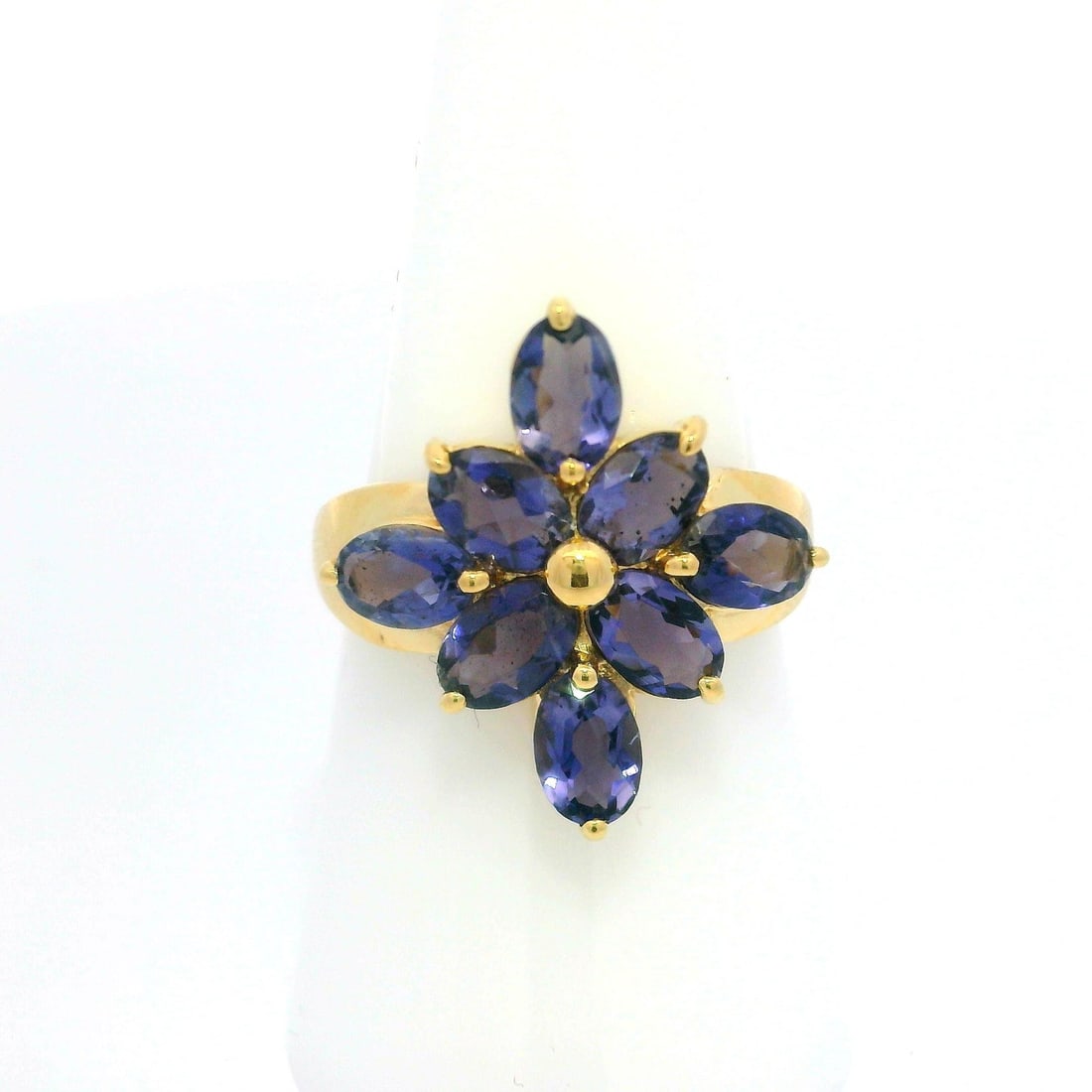 14k Yellow Gold Purple Tanzanite Flower Cluster Cocktail Ring: 14k Yellow Gold Purple Tanzanite Flower Cluster Cocktail Ring This stunning cocktail ring showcases a beautiful flower cluster design featuring eight natural genuine tanzanite stones. Each oval brilli