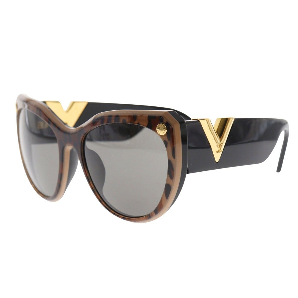 My Fair Lady Brown Sunglasses by Louis Vuitton: My Fair Lady Brown Sunglasses by Louis Vuitton Louis Vuitton My Fair Lady sunglasses in brown feature a stylish design with metal accents. The item is designed for female use and is in excellent condi