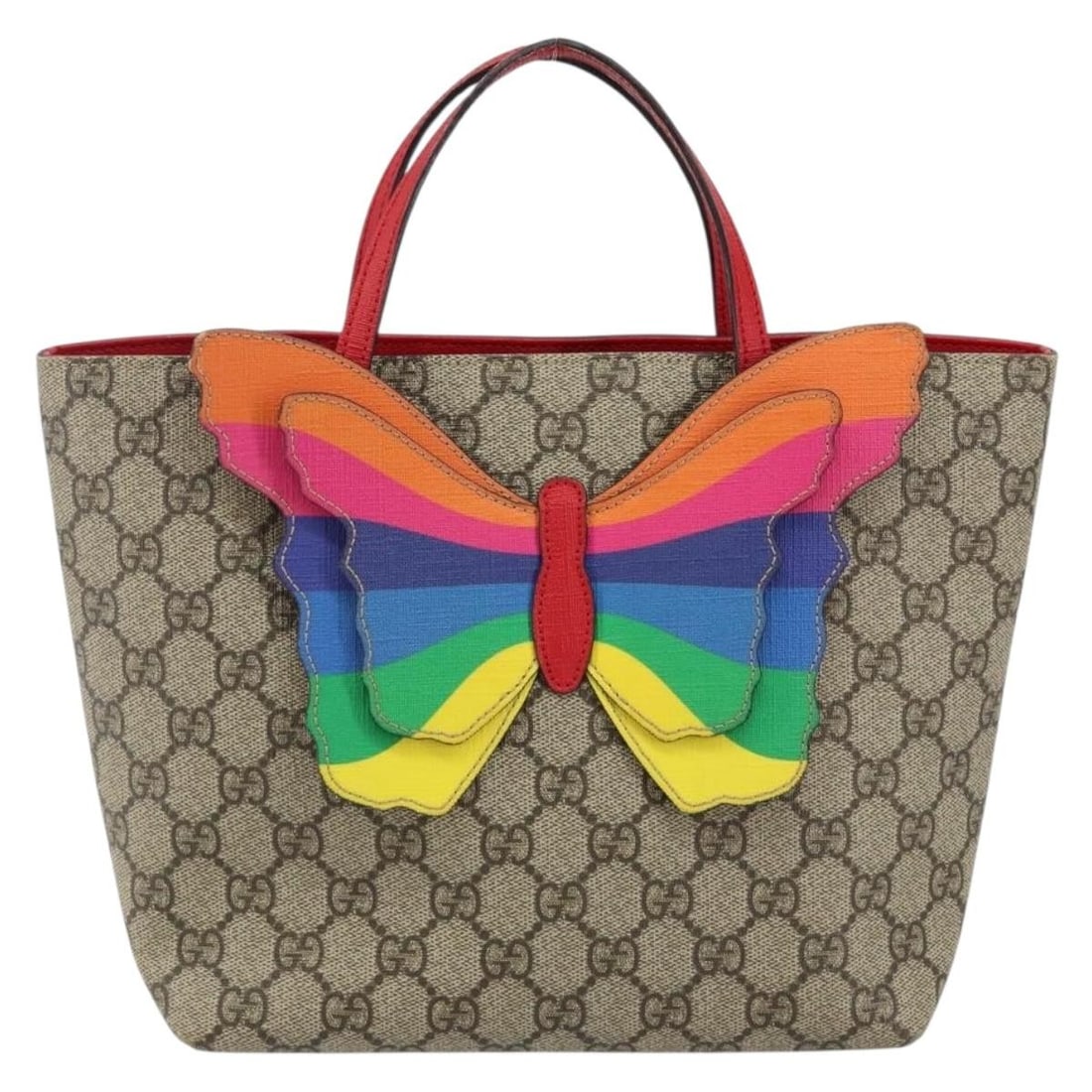 Children's beige tote bag featuring rainbow butterfly motif by Gucci: Children's beige tote bag featuring rainbow butterfly motif by Gucci This pre-owned Gucci Children's tote features a rainbow butterfly motif on beige material. The bag is designed for female use and r