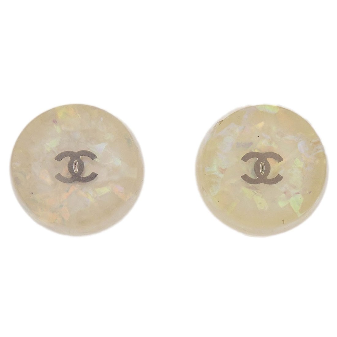 Chanel 99A White Acrylic Button Clip-On Earrings: Chanel 99A White Acrylic Button Clip-On Earrings Elevate your accessory collection with these stunning Chanel Button Clip-On Earrings. Crafted in France, these earrings feature a round shape with a ch