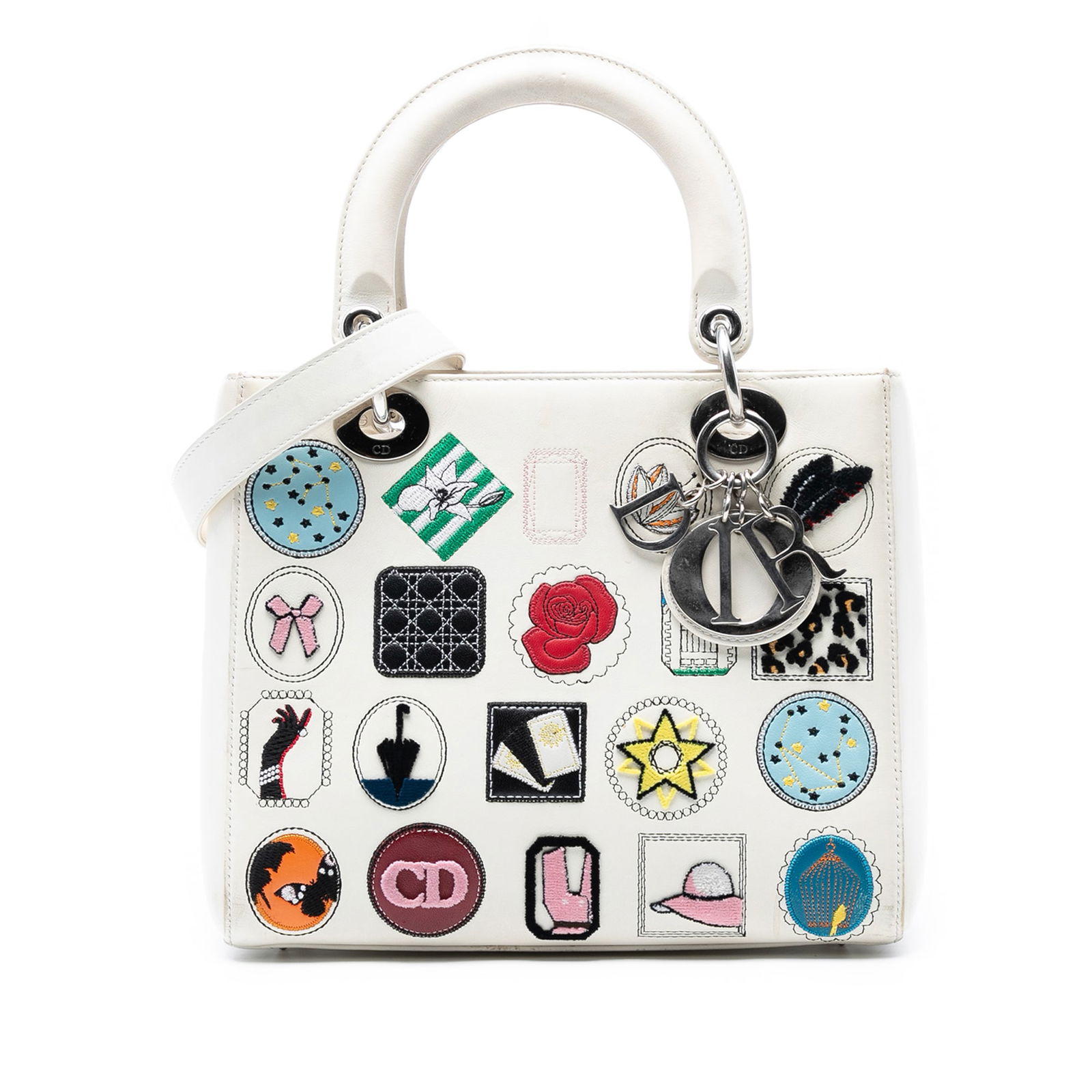 Dior Medium Calfskin Patch Embellished Lady Dior Bag White: Dior Medium Calfskin Patch Embellished Lady Dior Bag White This Medium Calfskin Patch Embellished Lady Dior bag showcases a unique leather body adorned with artistic patches. It features flat leather