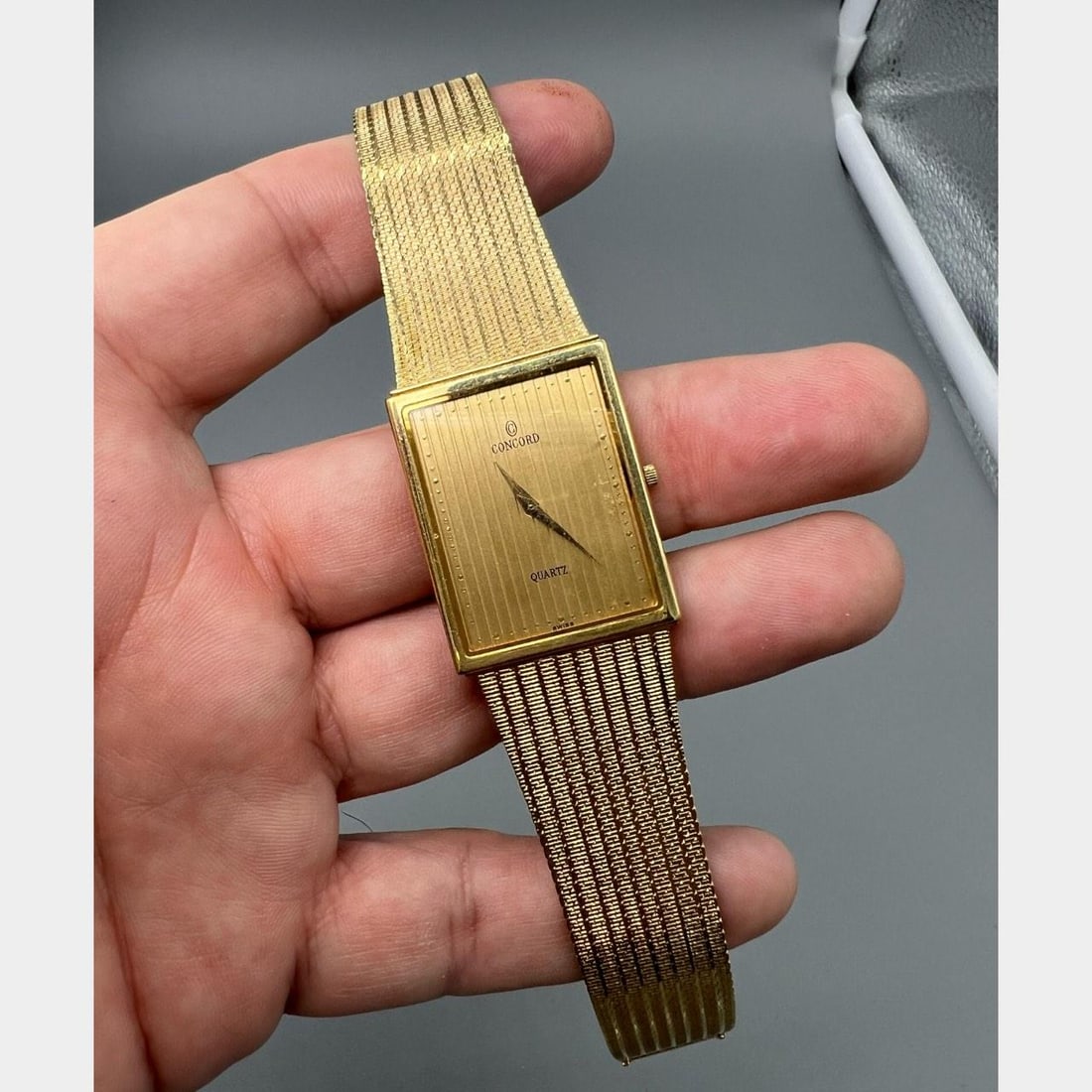 Concord 14K Gold Quartz Dress Watch With Box Booklets Extra Strap: Concord 14K Gold Quartz Dress Watch With Box Booklets Extra Strap This Concord dress watch features a 14K yellow gold case with a quartz movement. The watch weighs 52.8 grams and has a case size of 30