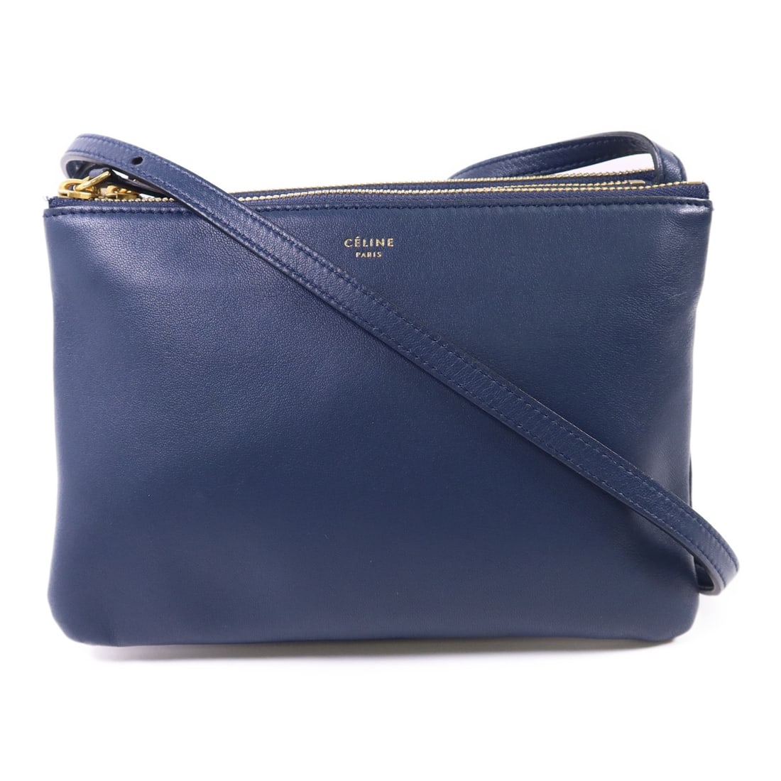 CELINE Navy Blue Lambskin Trio Shoulder Bag with GHW: CELINE Navy Blue Lambskin Trio Shoulder Bag with GHW Presenting the CELINE Trio Bag, a stylish shoulder bag crafted from premium lambskin leather in a sophisticated navy blue hue. This elegant accesso