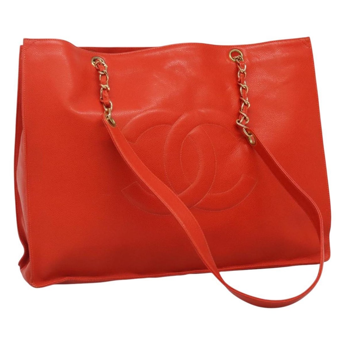 Orange Chanel Grand Shopping Tote Bag: Orange Chanel Grand Shopping Tote Bag This Chanel Grand Shopping Tote in orange is a stylish and practical bag designed for women. It features an exterior with some signs of use, including out-of-shap