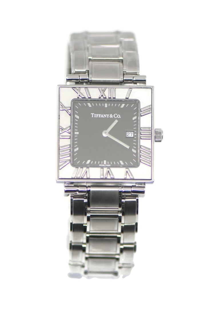 Tiffany & Co Atlas Quartz Stainless Steel Watch 28mm Authentic: Tiffany & Co Atlas Quartz Stainless Steel Watch 28mm Authentic Discover the timeless elegance of the Tiffany & Co. Atlas Stainless Steel Watch. This exquisite wristwatch features a sleek gray dial wit