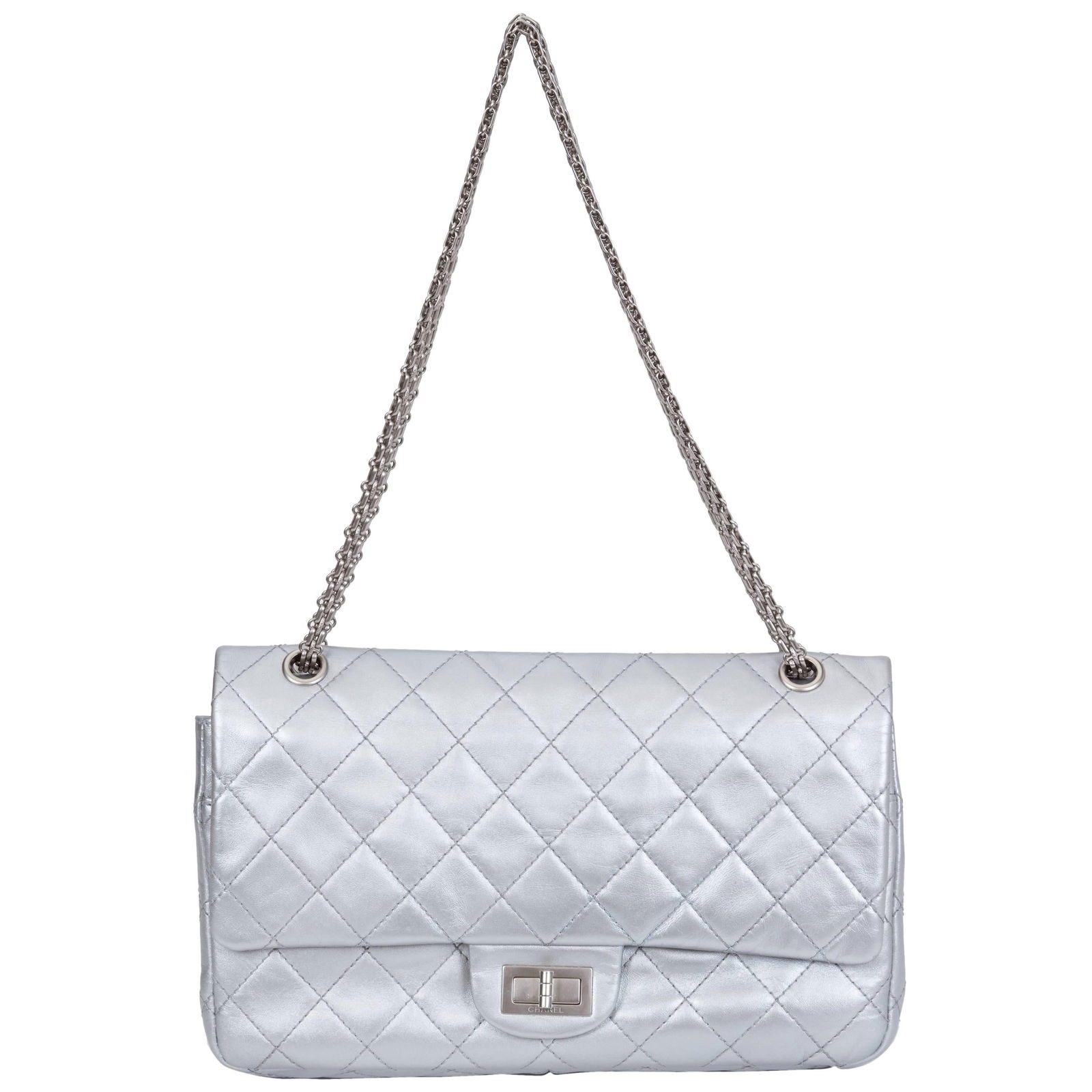 Chanel Silver Jumbo Reissue Double Flap Bag with Hologram: Chanel Silver Jumbo Reissue Double Flap Bag with Hologram This Chanel Silver Jumbo Reissue Double Flap is a stunning piece that combines luxury and functionality. Crafted from metallic silver leather,