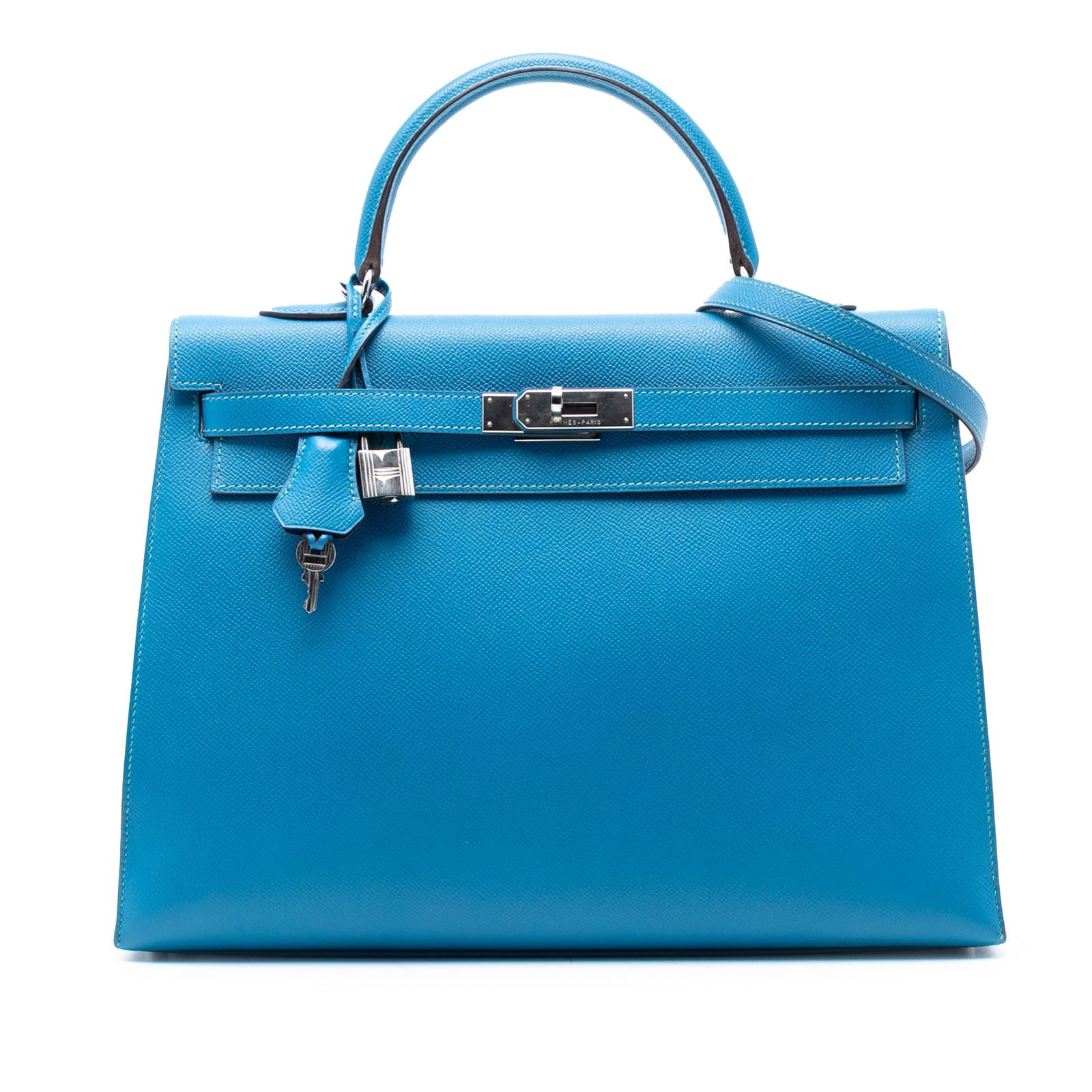Blue Frida Epsom Leather Kelly II Retourne 35 Bag with Strap: Blue Frida Epsom Leather Kelly II Retourne 35 Bag with Strap The Hermes Epsom Kelly II Retourne 35 is crafted from Epsom leather in the distinctive Blue Frida color. It features a structured design wi