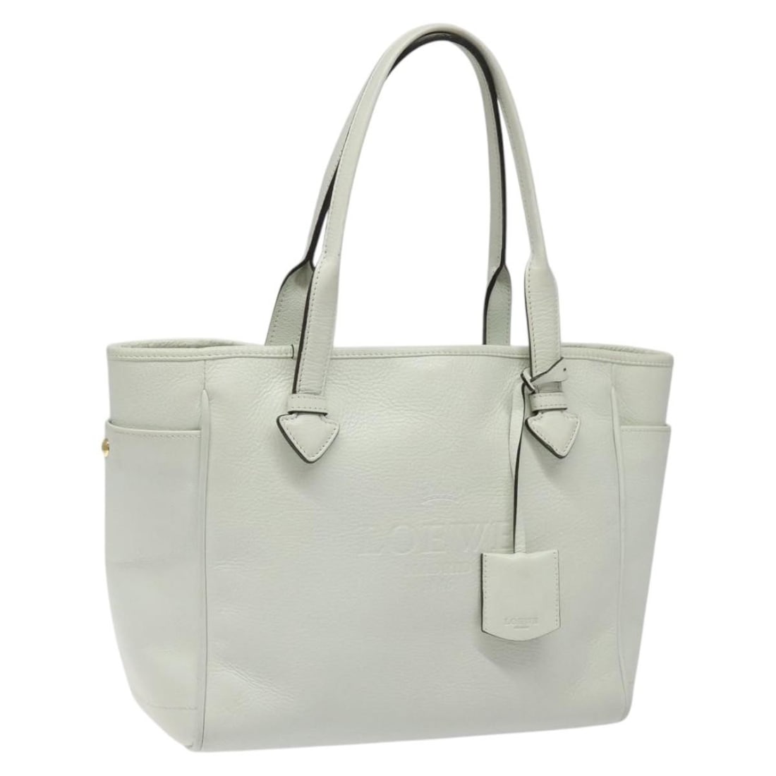 Heritage Tote Bag by Loewe in White: Heritage Tote Bag by Loewe in White This Loewe Heritage Tote in white features a spacious design with slight rubbing and stains on the exterior surface, as well as minor rubbing on the handle, inside,