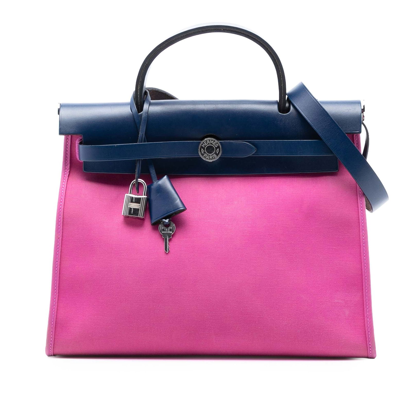 Herbag Zip 31 Pink Canvas Satchel by Hermes with Leather Handle: Herbag Zip 31 Pink Canvas Satchel by Hermes with Leather Handle The Herbag Zip 31 satchel features a pink canvas body with a flat leather top handle and a flat leather strap. It is designed with a fro