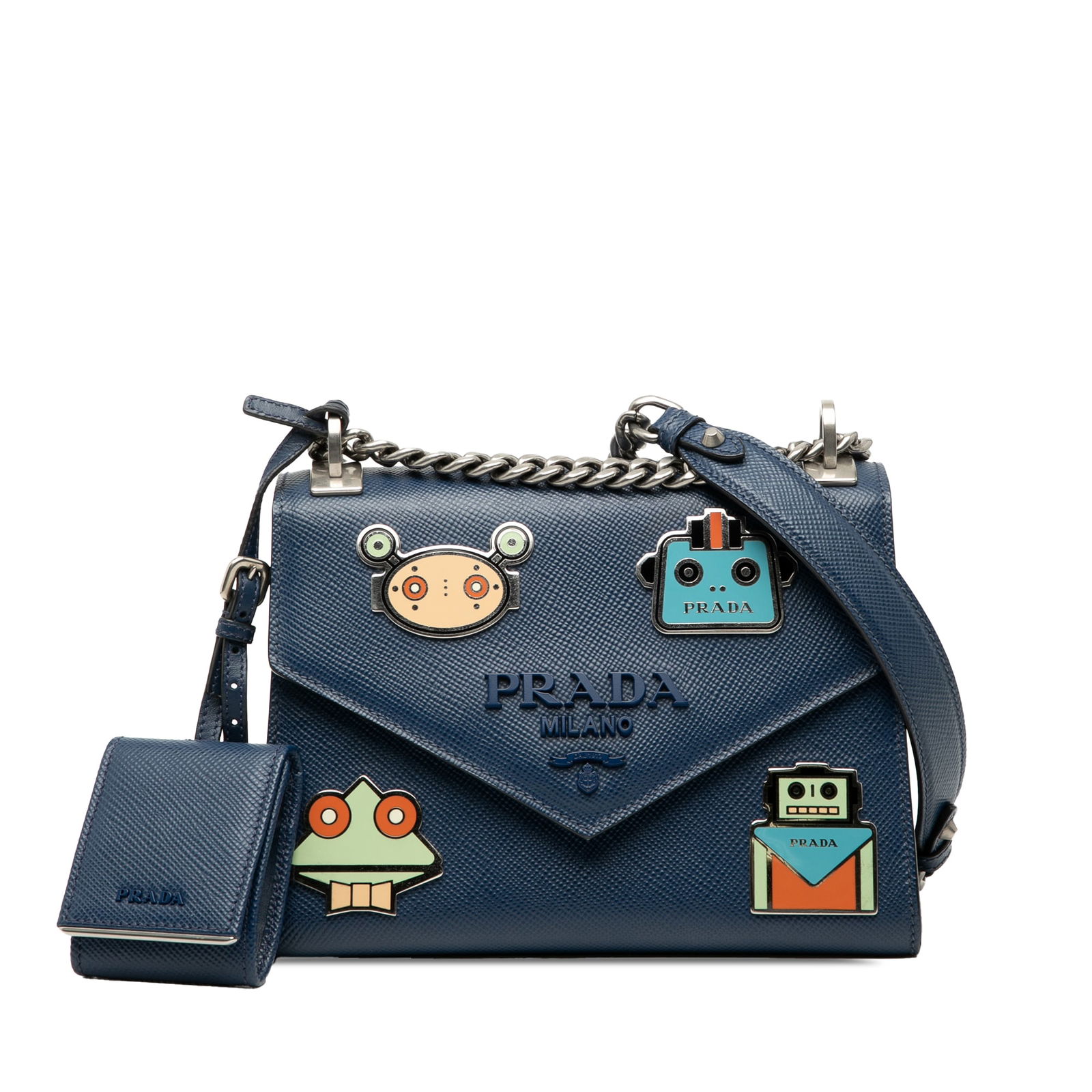 Prada Saffiano Cuir Monochrome Robot Patches Crossbody Bag: Prada Saffiano Cuir Monochrome Robot Patches Crossbody Bag Elevate your accessory collection with this stylish Prada crossbody bag, crafted from exquisite saffiano leather. Adorned with playful robot