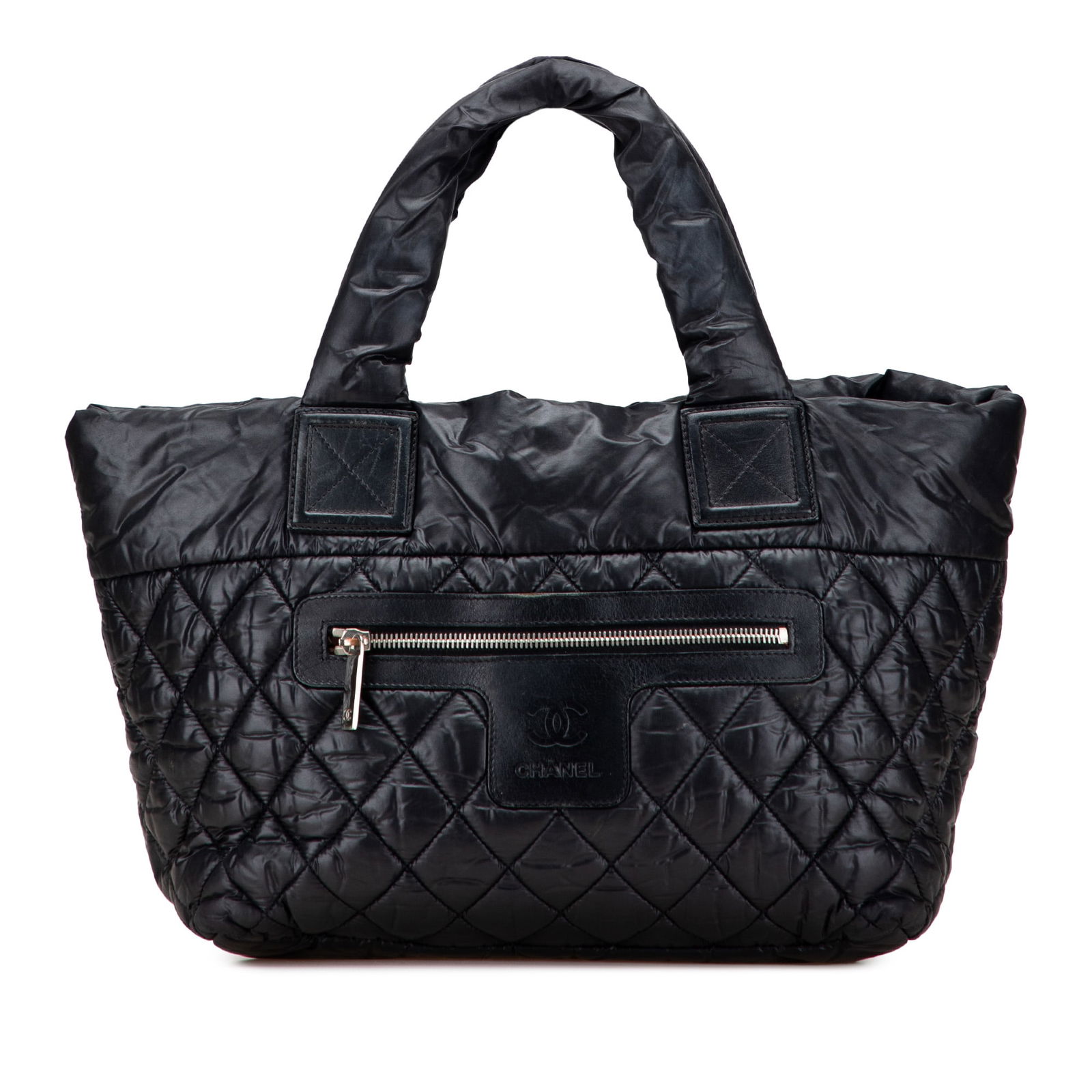 Chanel Black Small Quilted Nylon Coco Cocoon Tote Bag: Chanel Black Small Quilted Nylon Coco Cocoon Tote Bag This Chanel Small Quilted Nylon Coco Cocoon Tote is a stylish and functional accessory. Crafted from quilted nylon with elegant leather trim, it f