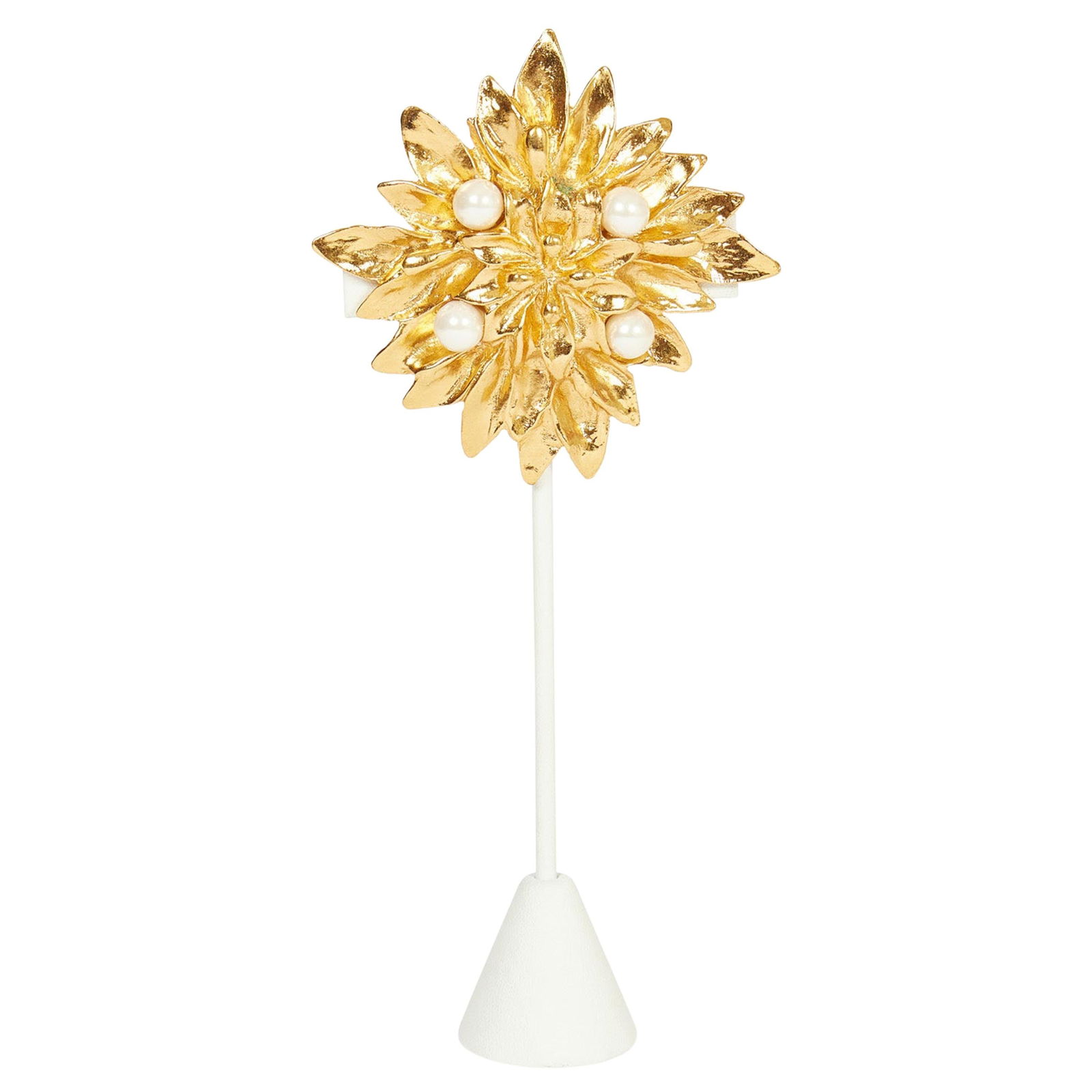 1980s Yves Saint Laurent Gold Pearl Starburst Brooch: 1980s Yves Saint Laurent Gold Pearl Starburst Brooch This stunning 1980s Yves Saint Laurent starburst brooch features a captivating design embellished with four elegant pearls. The brooch measures 3 i