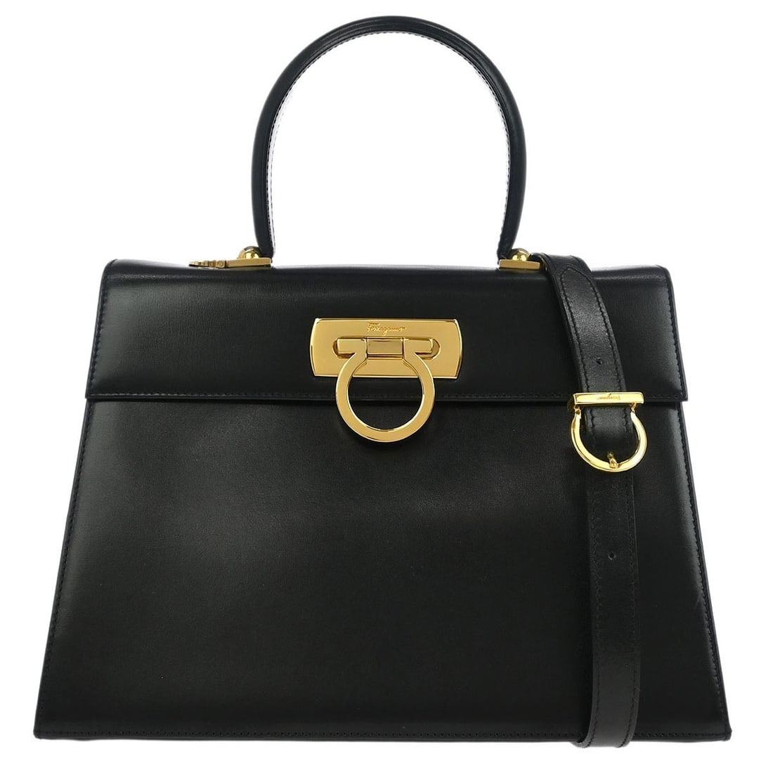 Convertible Gancini Top Handle Handbag by Salvatore Ferragamo in Black: Convertible Gancini Top Handle Handbag by Salvatore Ferragamo in Black This pre-owned Salvatore Ferragamo Gancini convertible top handle bag features a classic black design. It is in very good conditi