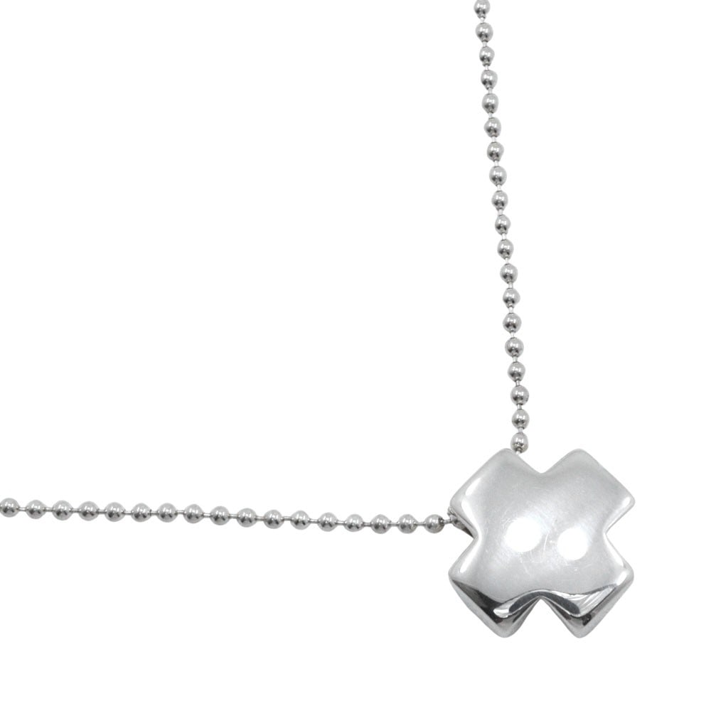 Roman Cross Pendant Necklace in Silver by Tiffany & Co.: Roman Cross Pendant Necklace in Silver by Tiffany & Co. This Tiffany & Co. Roman Cross necklace is crafted in polished silver and features a feminine design. The necklace is in pristine, un-used condi