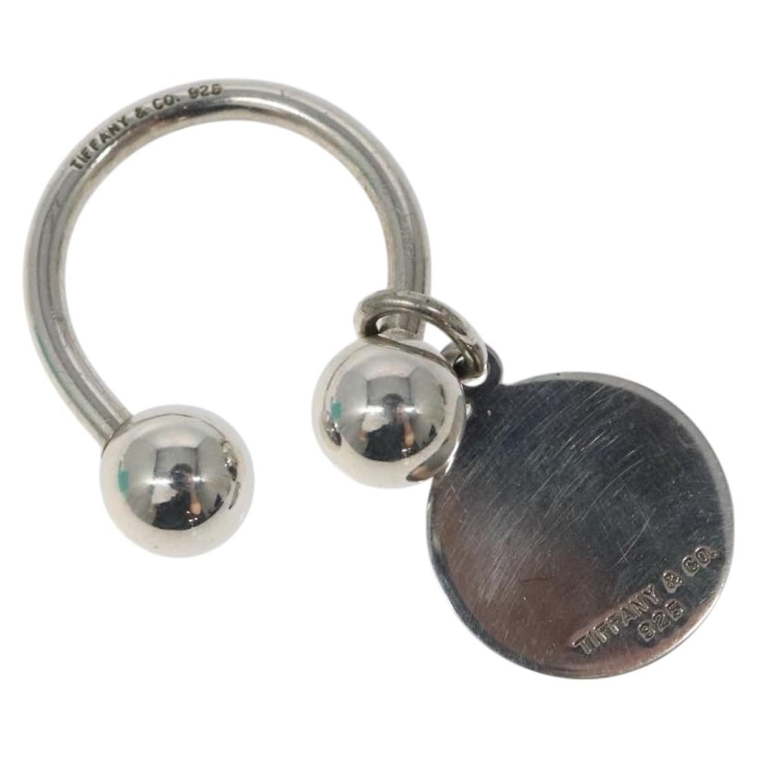 Authentic Tiffany & Co. Ag925 Silver Key Ring MY237: Authentic Tiffany & Co. Ag925 Silver Key Ring MY237 This authentic Tiffany & Co. key ring is crafted from high-quality Ag925 silver, showcasing a classic and elegant design. The key ring measures appr