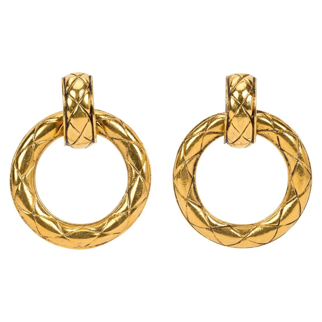 Chanel Vintage 1980s Gold Quilted Doorknocker Earrings with Box: Chanel Vintage 1980s Gold Quilted Doorknocker Earrings with Box Capture the essence of 1980s luxury with these vintage Chanel quilted doorknocker earrings. Crafted in France, these statement earrings