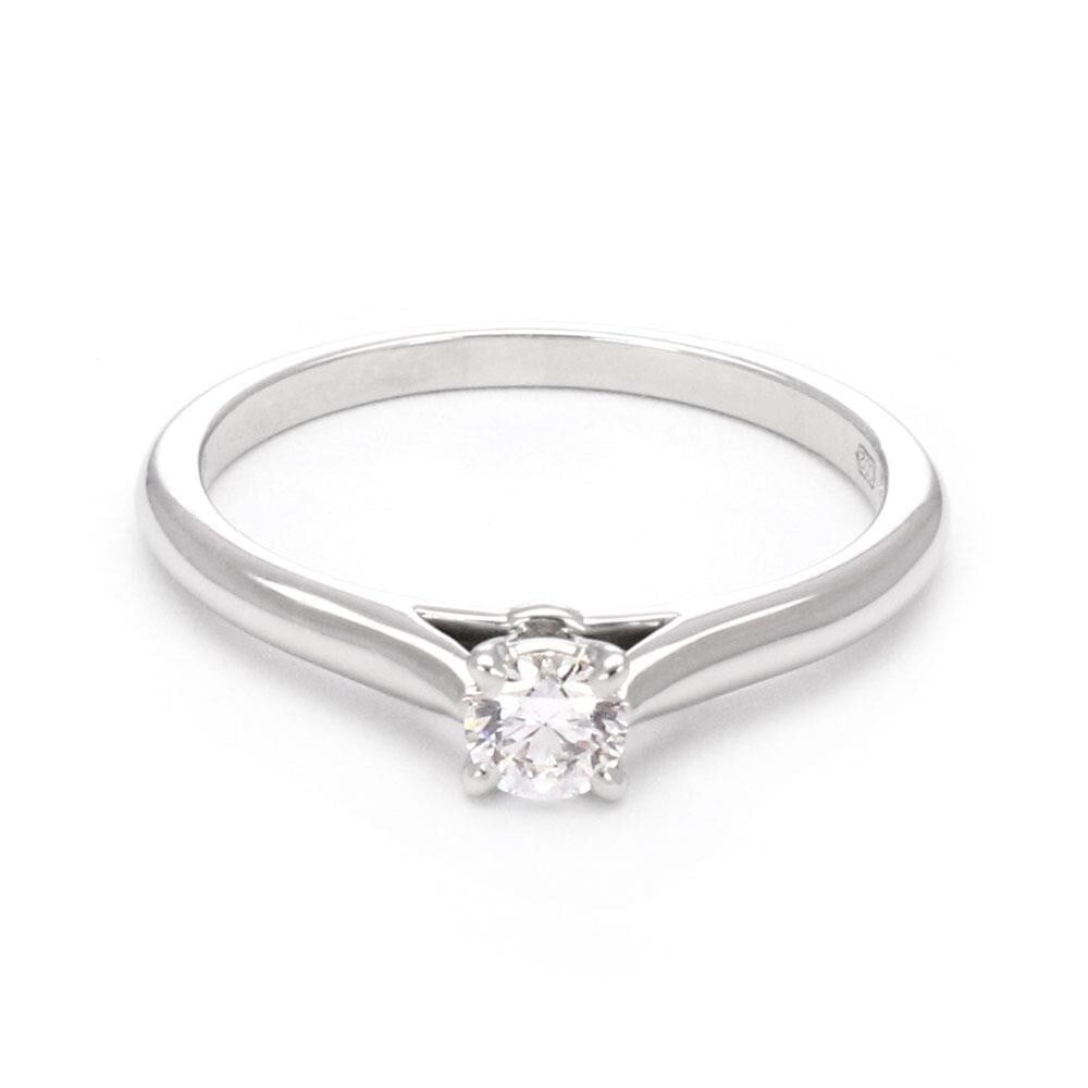 Cartier 0.18ct Diamond Platinum Solitaire Ring GIA Certified Size 5: Cartier 0.18ct Diamond Platinum Solitaire Ring GIA Certified Size 5 This exquisite Cartier solitaire ring showcases a stunning 0.18ct round brilliant diamond with an E color and VVS1 clarity, set in a
