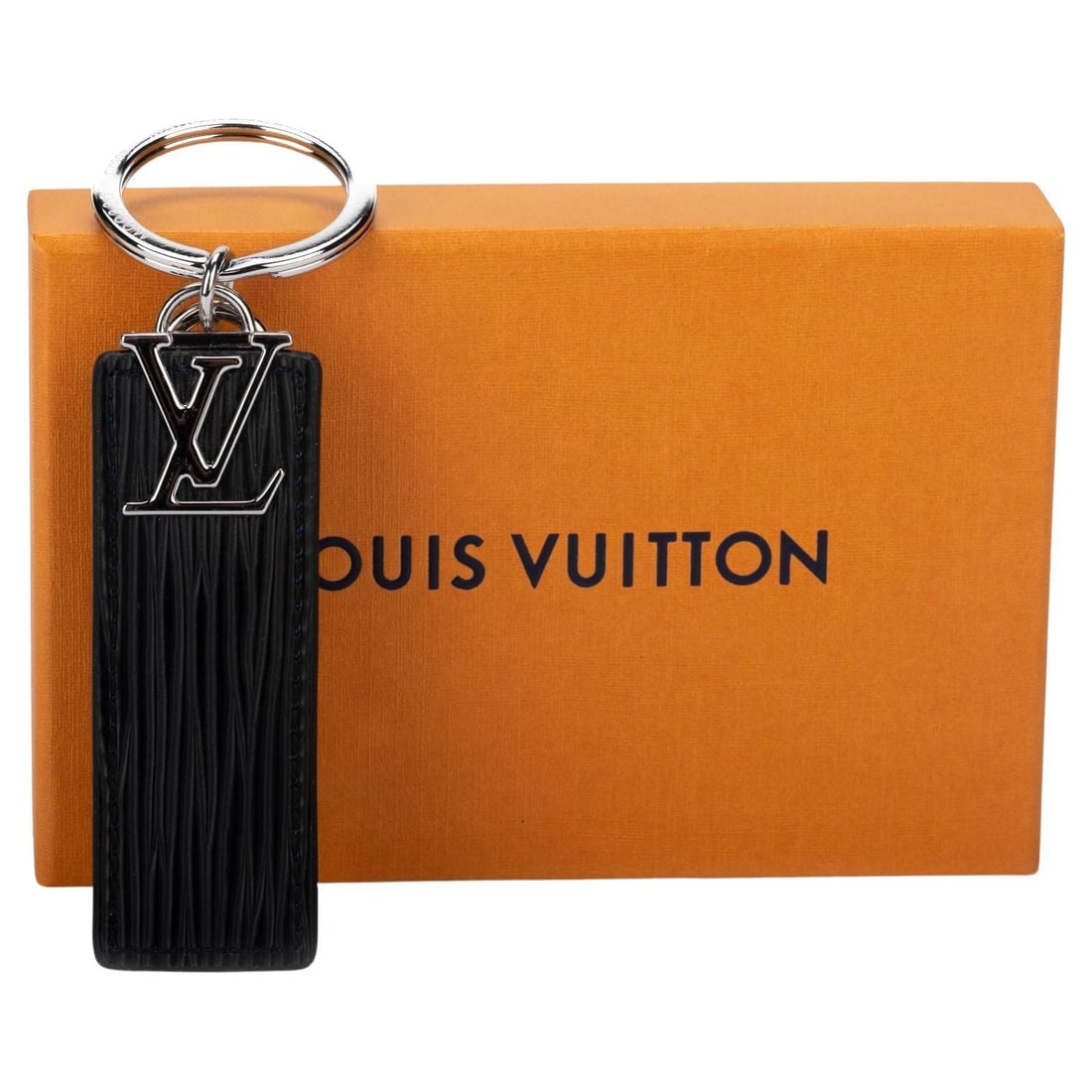 Louis Vuitton Reversible Blue Black Keychain Charm Italy Silver Tone: Louis Vuitton Reversible Blue Black Keychain Charm Italy Silver Tone Enhance your accessories collection with this exquisite Louis Vuitton reversible keychain or bag charm. Crafted in Italy, this piec