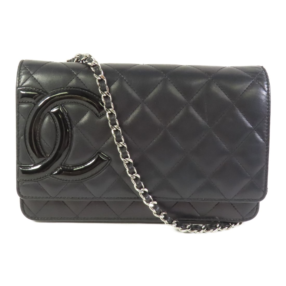 CHANEL Black Calfskin Wallet On Chain Shoulder Bag: CHANEL Black Calfskin Wallet On Chain Shoulder Bag Elevate your style with this exquisite CHANEL Wallet On Chain (WOC) shoulder bag, crafted from luxurious black calfskin leather. This elegant accesso