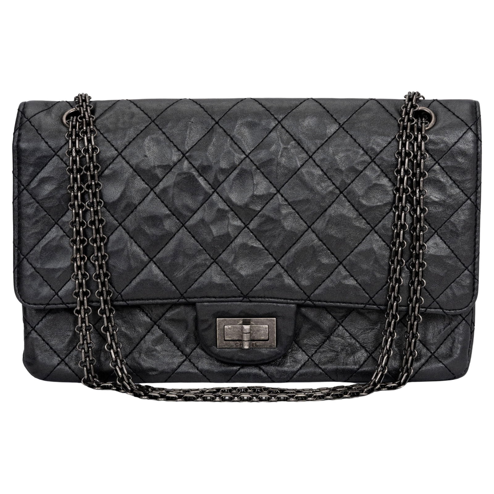 Chanel Jumbo Reissue 227 Black Aged Calfskin Handbag with Ruthenium Hardware: Chanel Jumbo Reissue 227 Black Aged Calfskin Handbag with Ruthenium Hardware This stunning Chanel Jumbo Reissue 227 handbag is crafted from luxurious black calfskin, showcasing an elegant design with