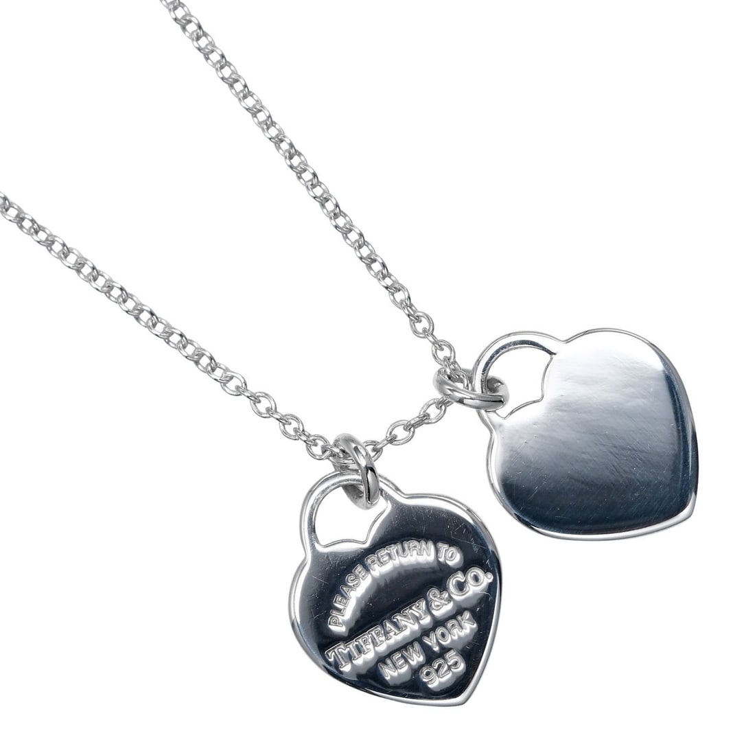 Return to Tiffany Double Heart Pendant Silver Necklace: Return to Tiffany Double Heart Pendant Silver Necklace This is a polished Tiffany & Co. Return to Tiffany Double Heart Tag Pendant Necklace in silver. Designed for women, it remains in excellent condi