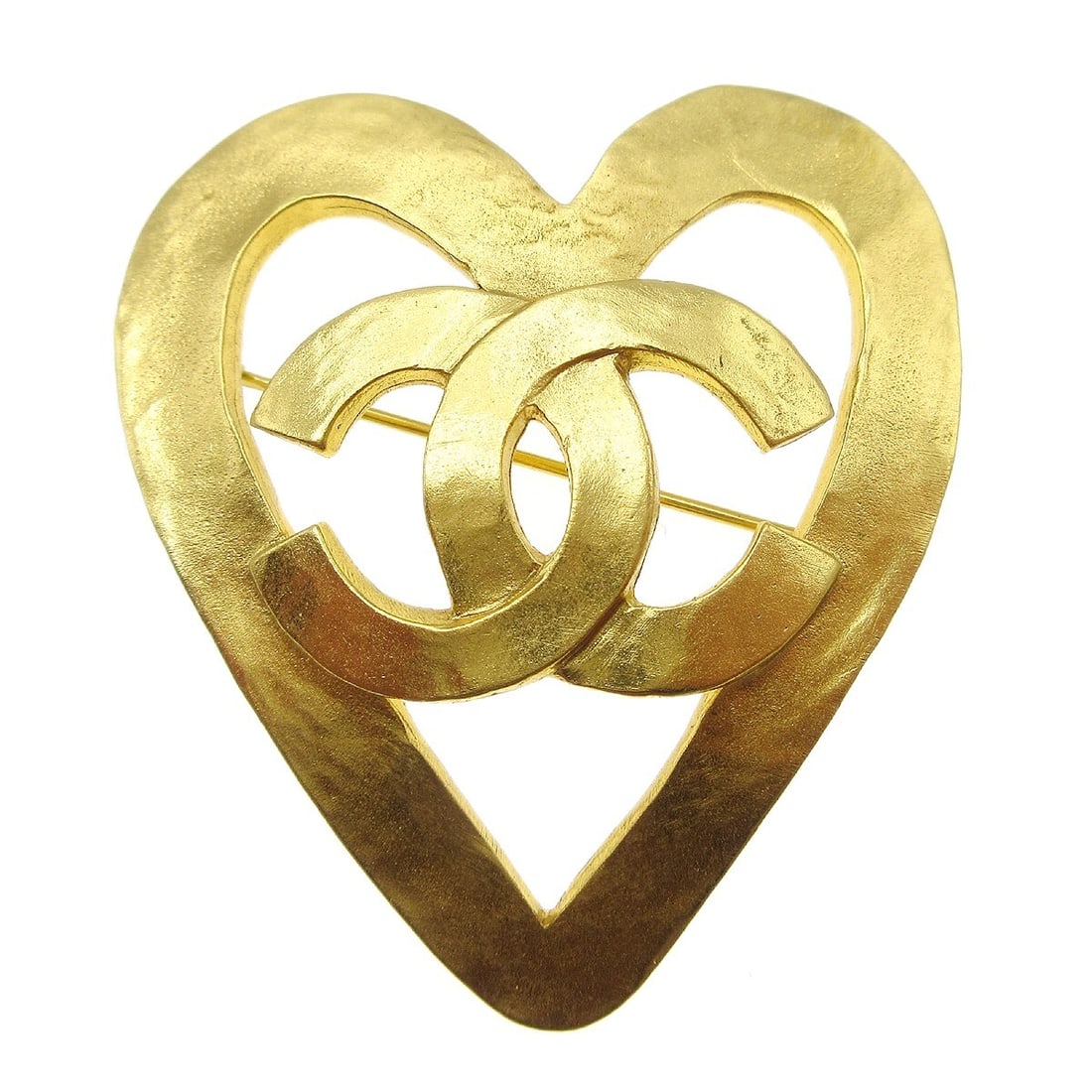 Chanel Gold-Plated Heart Brooch 95P 2in: Chanel Gold-Plated Heart Brooch 95P 2in This exquisite Chanel heart brooch is a stunning accessory that adds a touch of elegance to any outfit. Crafted from gold-plated metal, it features a charming h