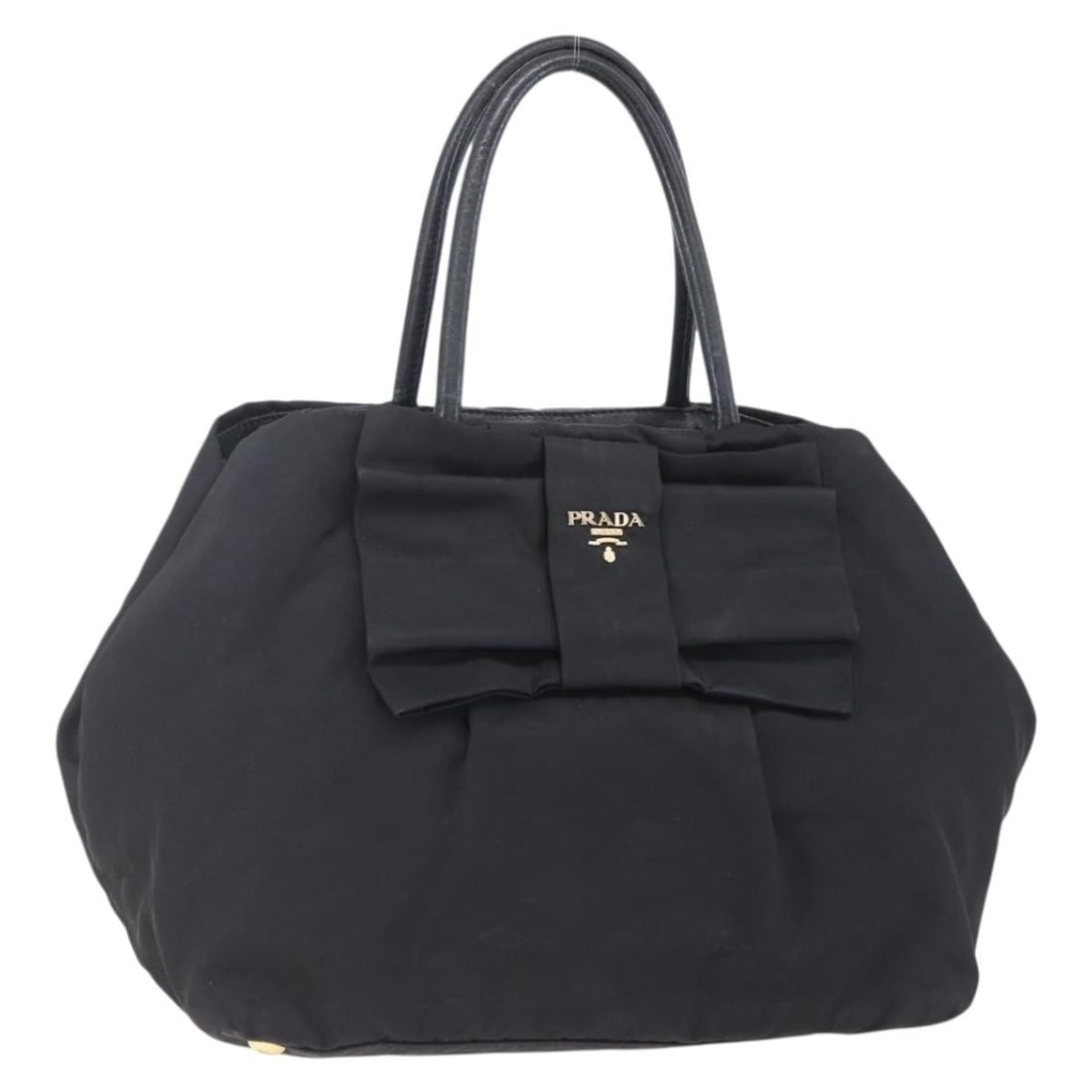 Black Prada Bow Tote Nylon Handbag: Black Prada Bow Tote Nylon Handbag This pre-owned Prada Bow Tote is crafted from black nylon and features leather accents. The handbag shows signs of use, including surface loss of shape, rubbing, sta