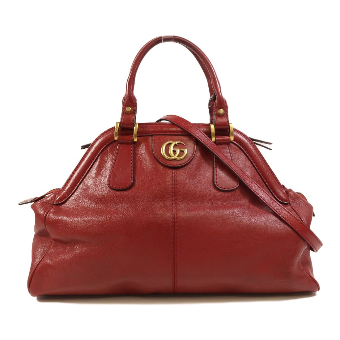 Red Calfskin Liber 2 Way Shoulder Bag by Gucci GG Gold Hardware: Red Calfskin Liber 2 Way Shoulder Bag by Gucci GG Gold Hardware This GUCCI Liber 2-way shoulder bag is crafted from calfskin leather in a striking red color. Designed for versatility, it can be carrie