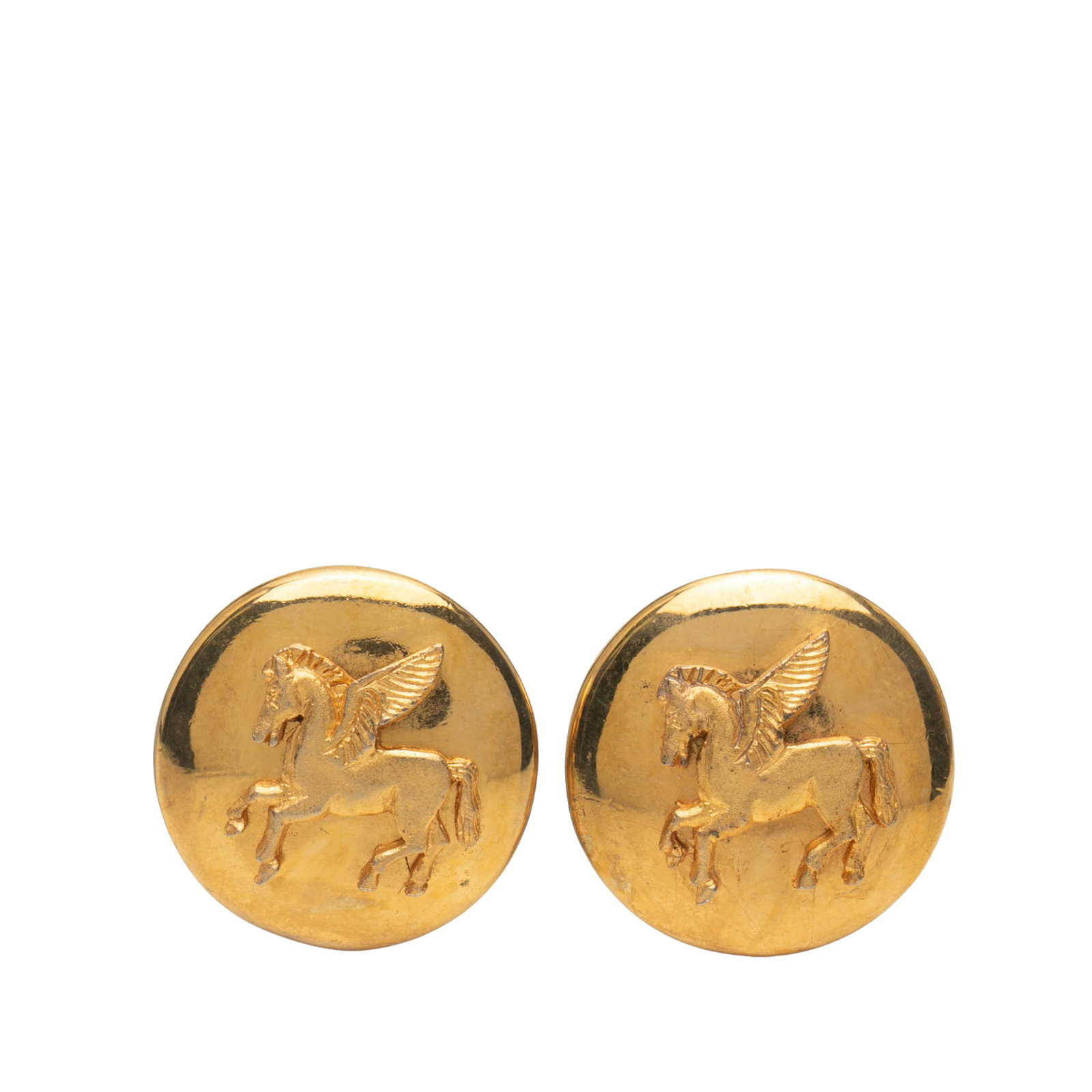 Hermes Gold Plated Pegasus Clip On Earrings Vintage Style: Hermes Gold Plated Pegasus Clip On Earrings Vintage Style Elevate your accessory collection with these exquisite Hermes Gold Plated Pegasus Round Clip-on Earrings. Crafted with a radiant gold-plated m