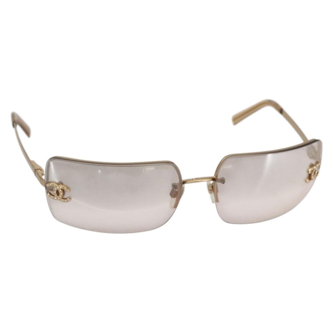 CHANEL Gold Tone Metal Sunglasses Made in Italy: CHANEL Gold Tone Metal Sunglasses Made in Italy Elevate your style with these authentic CHANEL sunglasses, crafted in Italy. Featuring a luxurious gold-tone metal frame, these sunglasses are not only