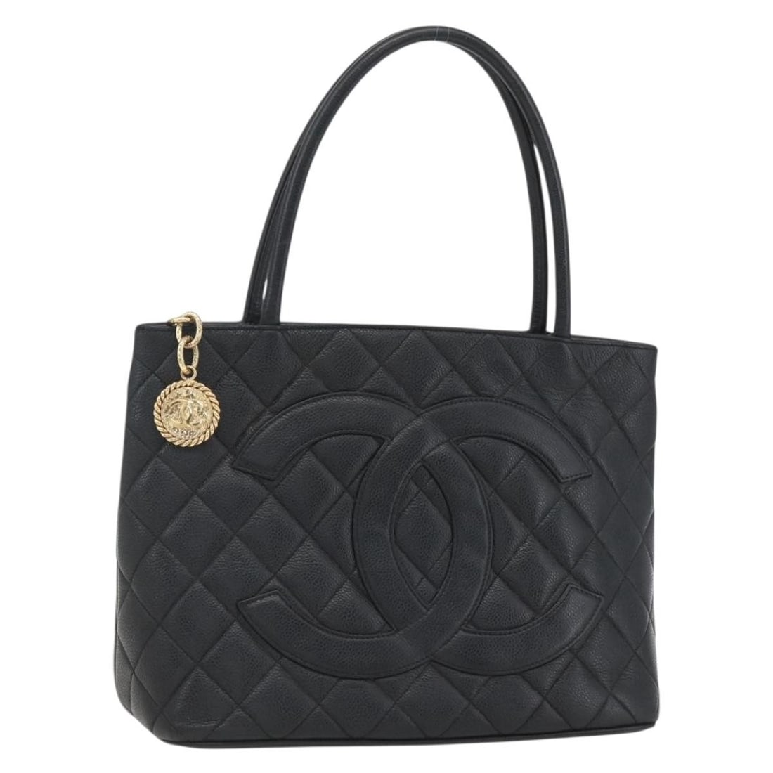 Black Caviar Skin CHANEL Tote Bag with CC Logo and Guarantee Card: Black Caviar Skin CHANEL Tote Bag with CC Logo and Guarantee Card This CHANEL tote bag is crafted from black caviar grained calfskin, featuring the signature CC logo. The bag offers a structured silho