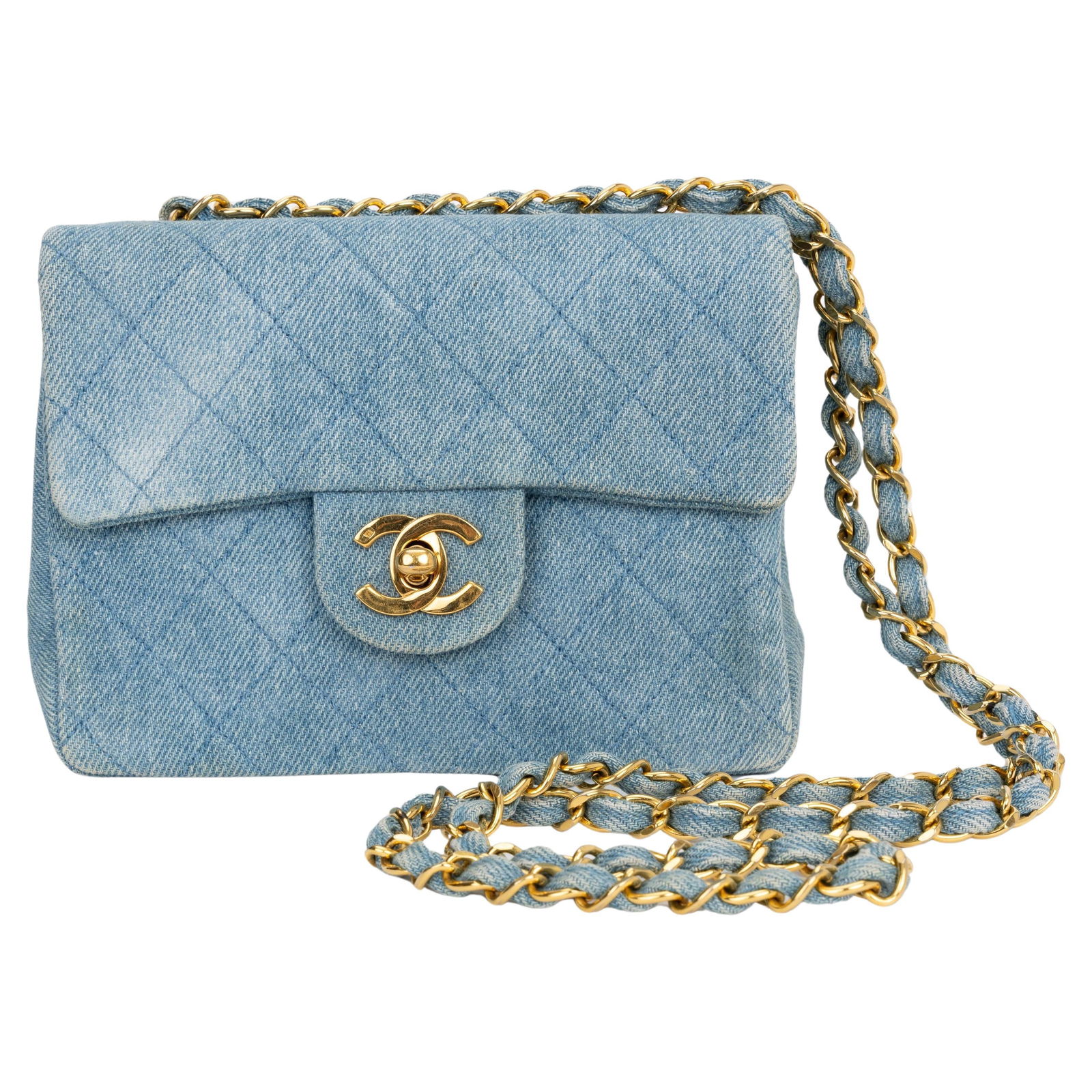 Chanel Denim Mini Quilt Flap Crossbody with Hologram and Dust Cover: Chanel Denim Mini Quilt Flap Crossbody with Hologram and Dust Cover The Chanel Denim Mini Quilt Flap Crossbody is a stylish and practical accessory, perfect for any fashion-forward individual. This ex