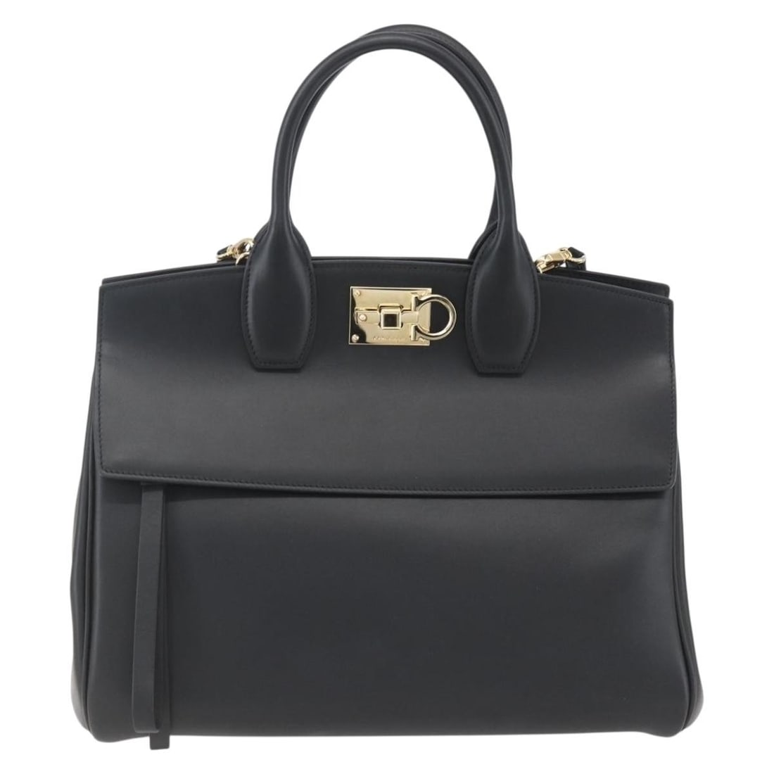 Studio Satchel Handbag by Salvatore Ferragamo in Black: Studio Satchel Handbag by Salvatore Ferragamo in Black This pre-owned Salvatore Ferragamo Studio Satchel in black offers a classic and versatile style. The handbag features the signature Gancini detai
