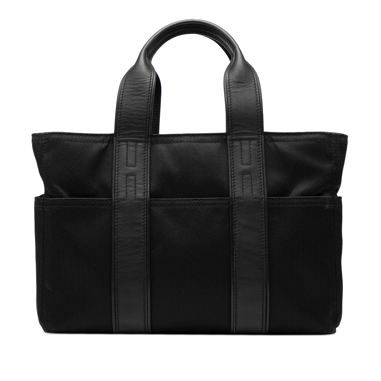 Hermes Toile Acapulco PM Black Canvas Bag: Hermes Toile Acapulco PM Black Canvas Bag The Hermes Toile Acapulco PM is a stylish bag designed for practicality and elegance. Constructed with a durable canvas body, it features flat leather handles