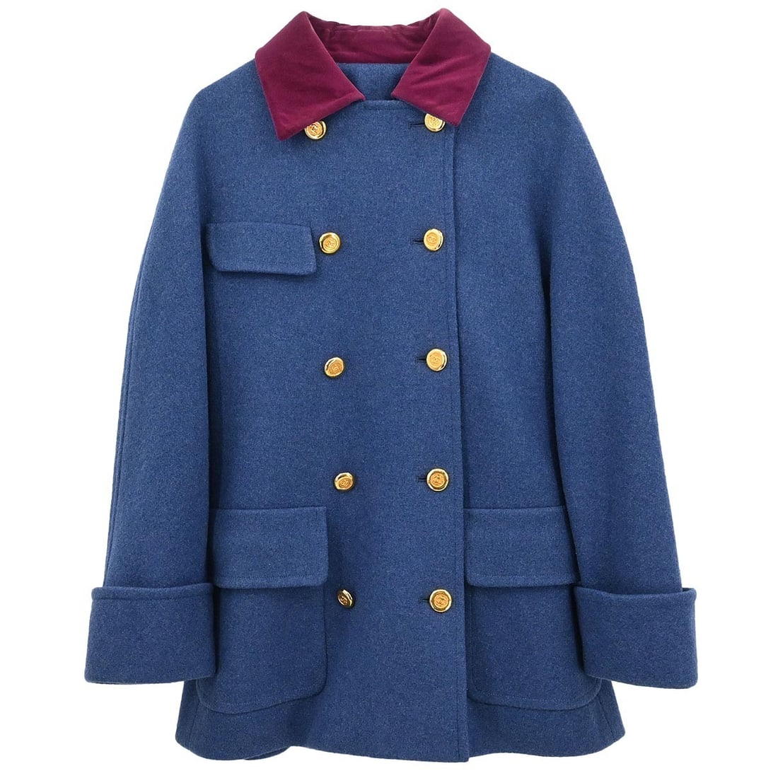 Blue Double Breasted Mid-Length Jacket by Chanel: Blue Double Breasted Mid-Length Jacket by Chanel This vintage Chanel double-breasted jacket features a classic mid-length cut with long sleeves and a collared neckline. The jacket is designed in blue