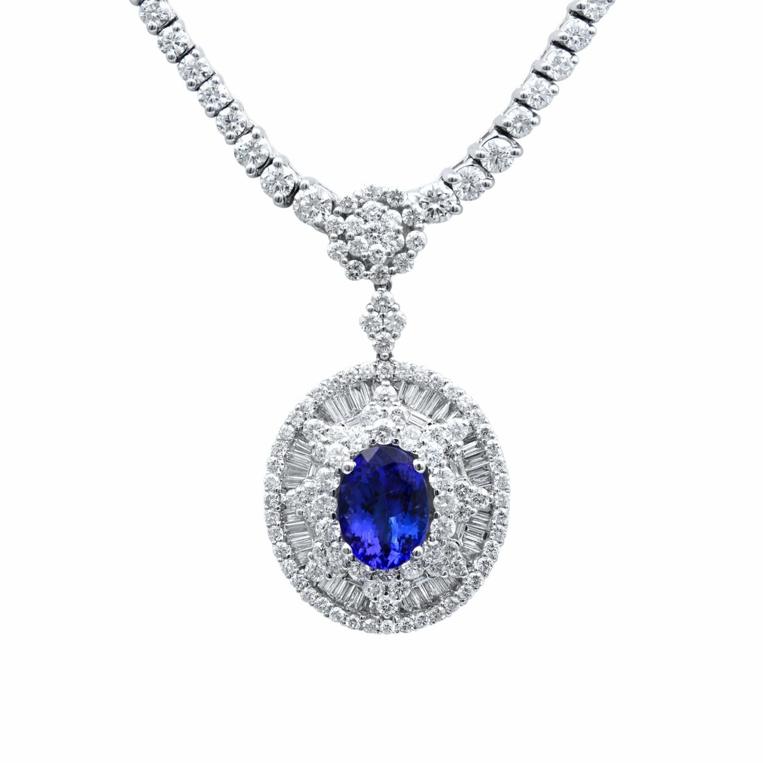 Rachel Koen 18K White Gold Tanzanite Diamond Necklace 9.3 ctw IGI Certified: Rachel Koen 18K White Gold Tanzanite Diamond Necklace 9.3 ctw IGI Certified Elevate your style with this stunning 18K white gold necklace featuring a captivating oval-cut blue tanzanite and sparkling