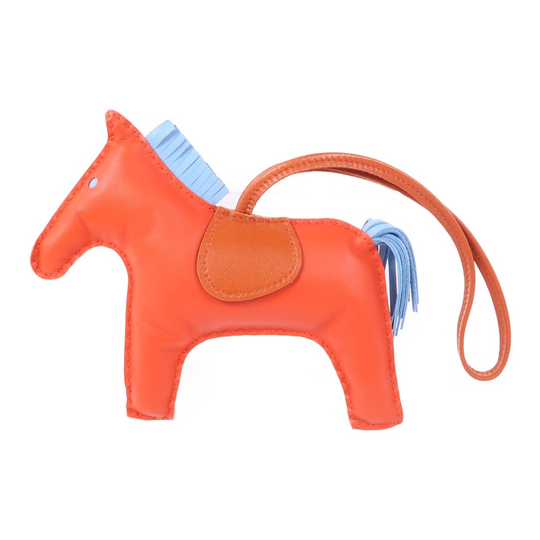 HERMES Rodeo GM Red Lambskin Leather Charm: HERMES Rodeo GM Red Lambskin Leather Charm Introducing the HERMES Rodeo GM Charm crafted from luxurious lambskin in a vibrant red hue. This charming accessory is perfect for adding a touch of elegance