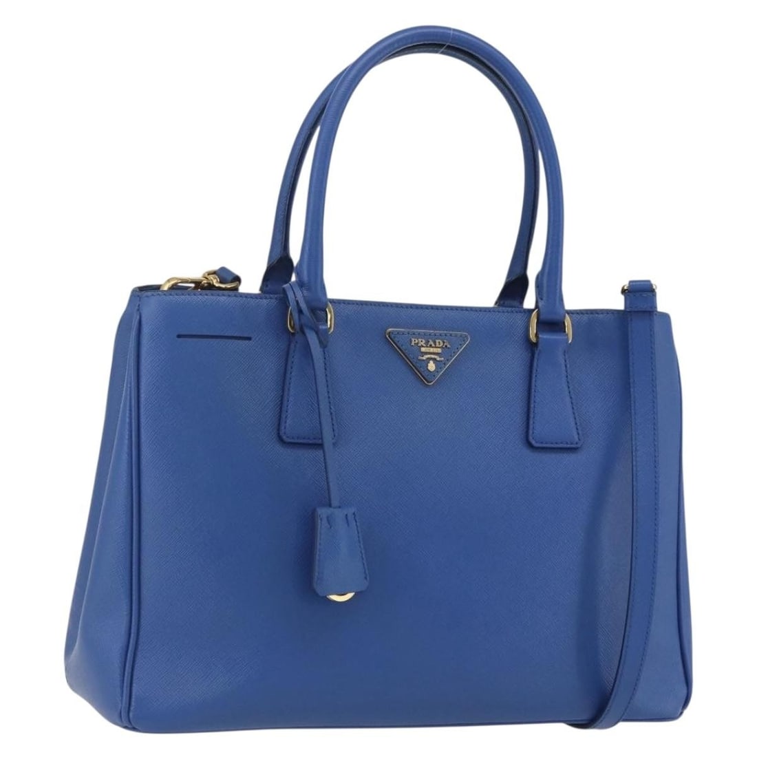 Blue Gardener's Tote Bag by Prada: Blue Gardener's Tote Bag by Prada This pre-owned Prada Gardener's Tote is in excellent condition, displaying minimal signs of use and no noticeable scratches on the surface, interior, pockets, or corn