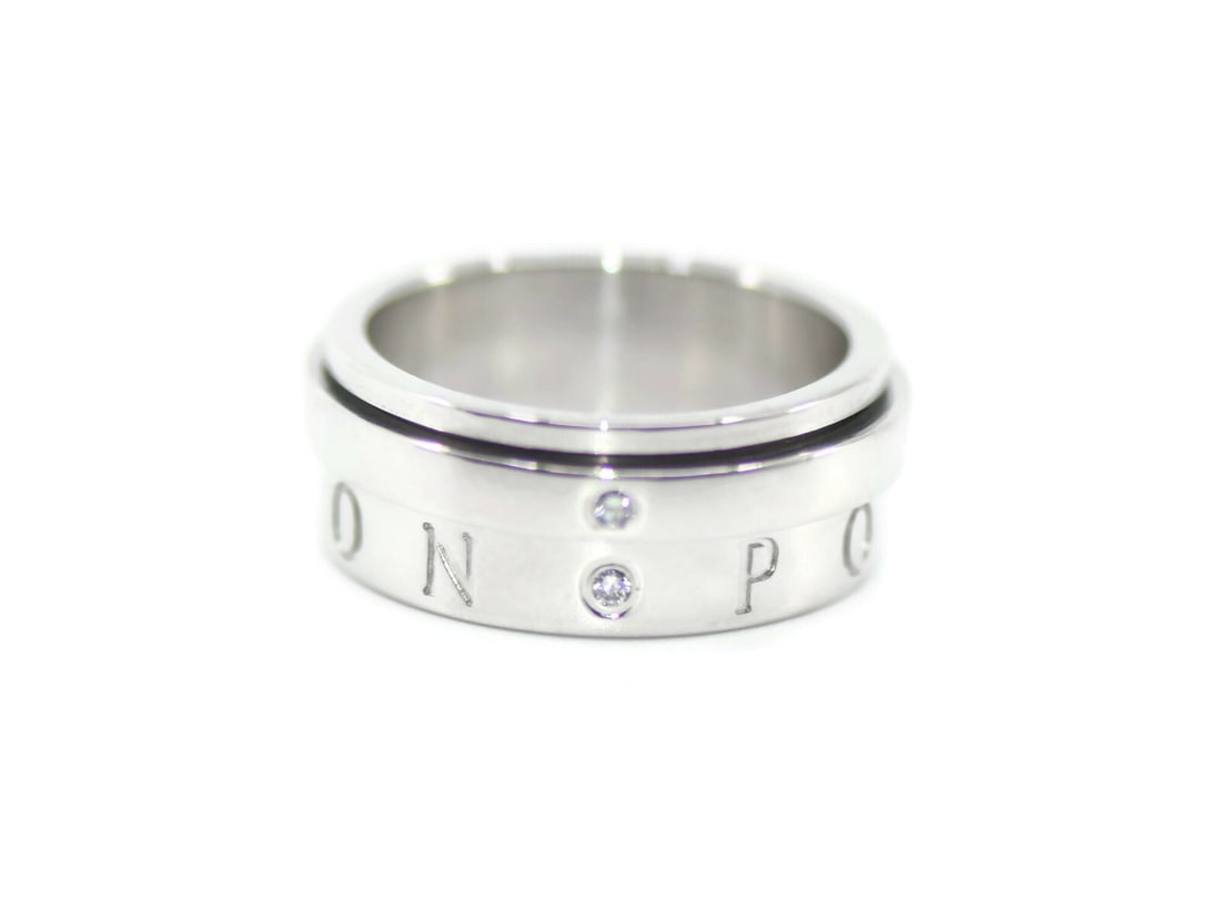 Piaget Possession 18K White Gold Diamond Ring with Box: Piaget Possession 18K White Gold Diamond Ring with Box This exquisite Piaget Possession ring showcases a stunning diamond set in luxurious 18K white gold. The ring features a comfortable size 54 (US s