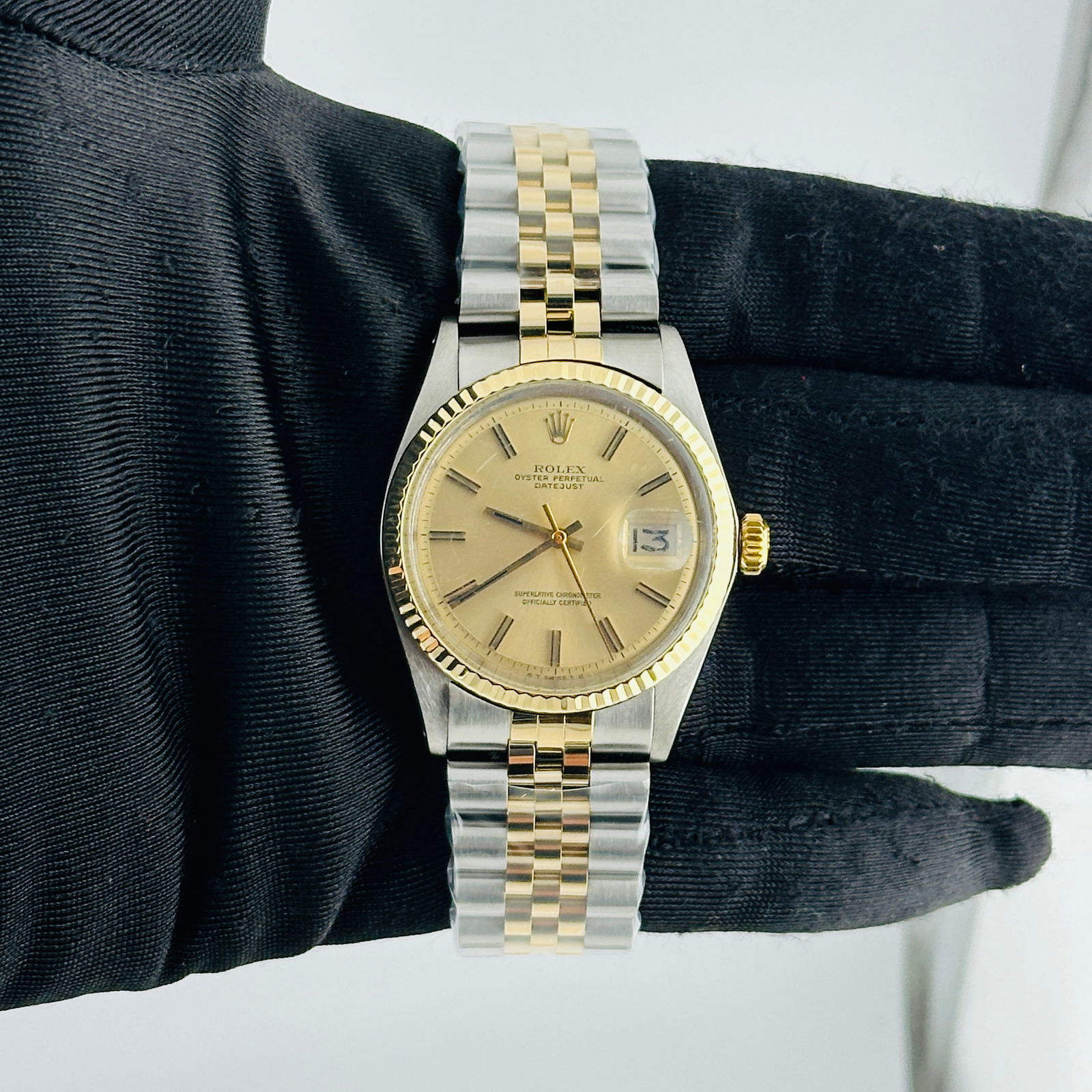Datejust Ref 1601 Champagne Stick Dial Aftermarket Jubilee Bracelet: Datejust Ref 1601 Champagne Stick Dial Aftermarket Jubilee Bracelet This Rolex Datejust features a champagne stick dial, a fluted bezel, and is presented on an aftermarket Jubilee bracelet. The watch