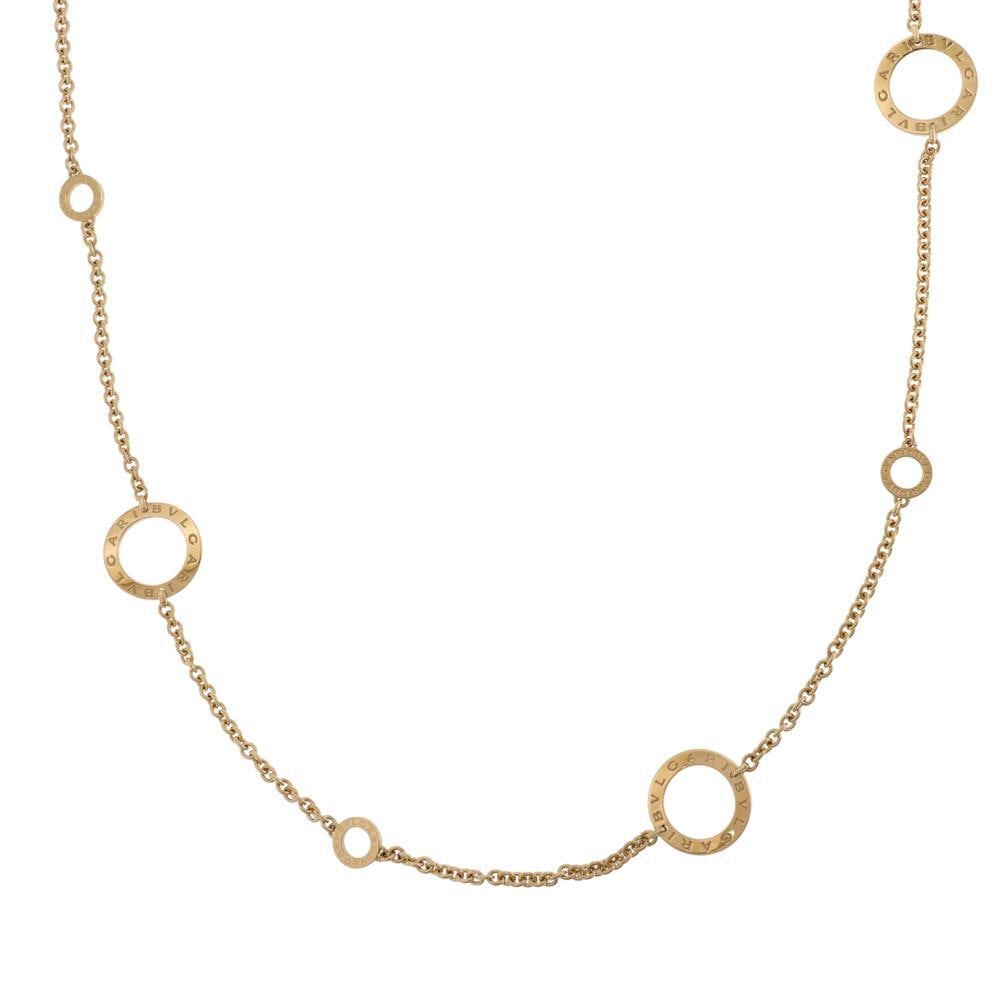 Bvlgari 18k Yellow Gold Signature Necklace 37" Long with 6 Circle Motifs: Bvlgari 18k Yellow Gold Signature Necklace 37" Long with 6 Circle Motifs This exquisite necklace from Bvlgari's Signature collection features a stunning design crafted from 18k yellow gold. It showcas