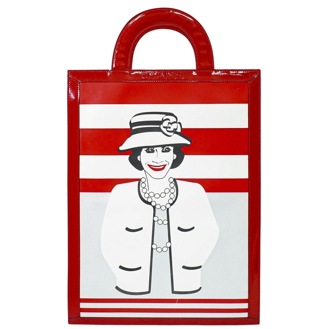 Vintage Chanel Portrait Tote Bag in Black Red and White: Vintage Chanel Portrait Tote Bag in Black Red and White This pre-owned Chanel vintage portrait tote bag features a classic black, red, and white color palette. Crafted from patent leather, the bag dis