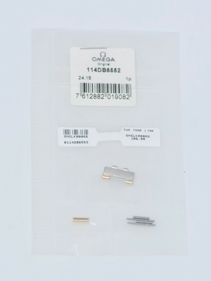 Authentic Omega 18K Gold Stainless Steel Band Link 14mm 6552: Authentic Omega 18K Gold Stainless Steel Band Link 14mm 6552 This authentic Omega band link is crafted from a combination of 18K gold and stainless steel, ensuring durability and a luxurious finish. D