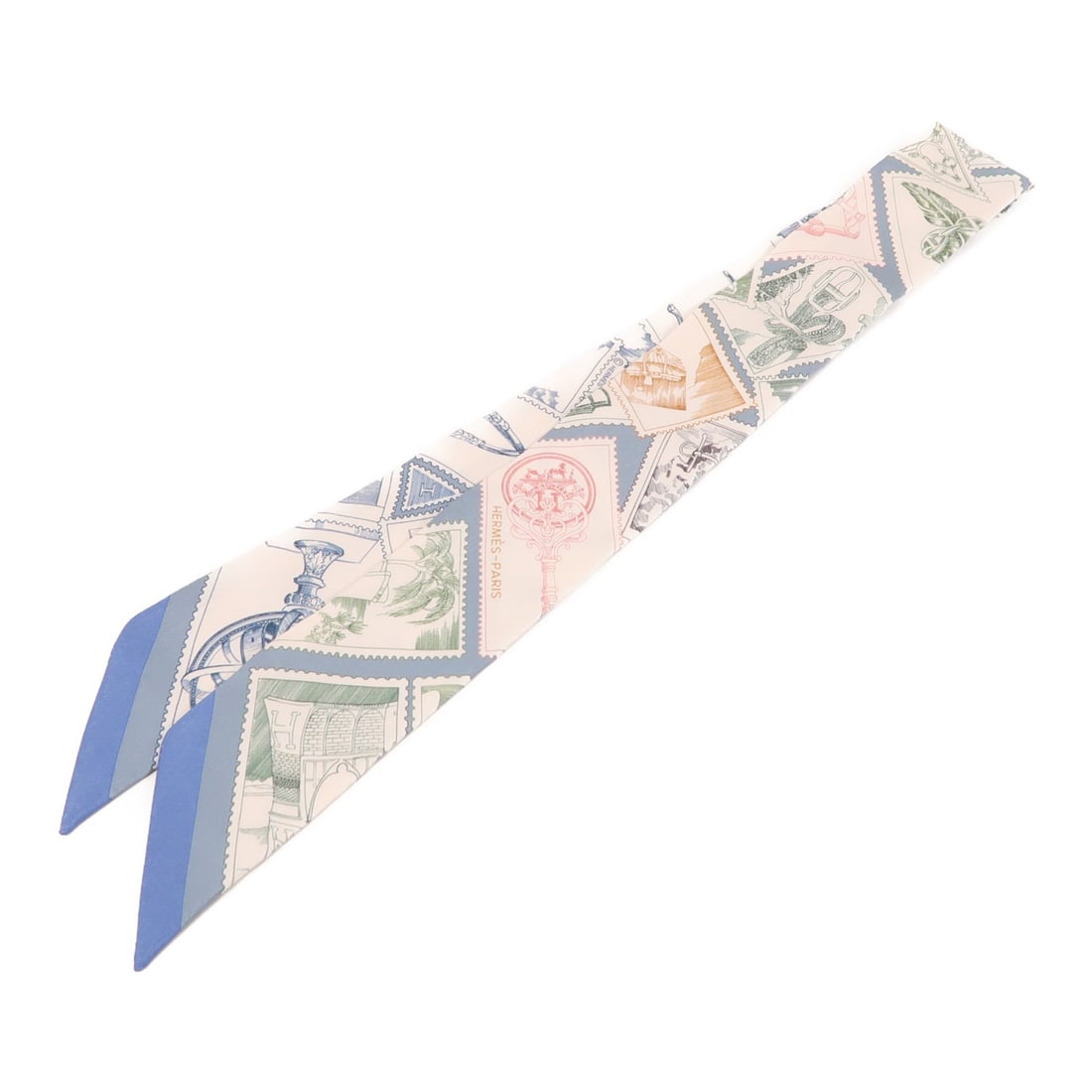 HERMES Silk Twilly Scarf in White and Blue: HERMES Silk Twilly Scarf in White and Blue Elevate your accessory collection with this exquisite HERMES Twilly Scarf. Crafted from luxurious silk, this scarf features a pristine white color that adds