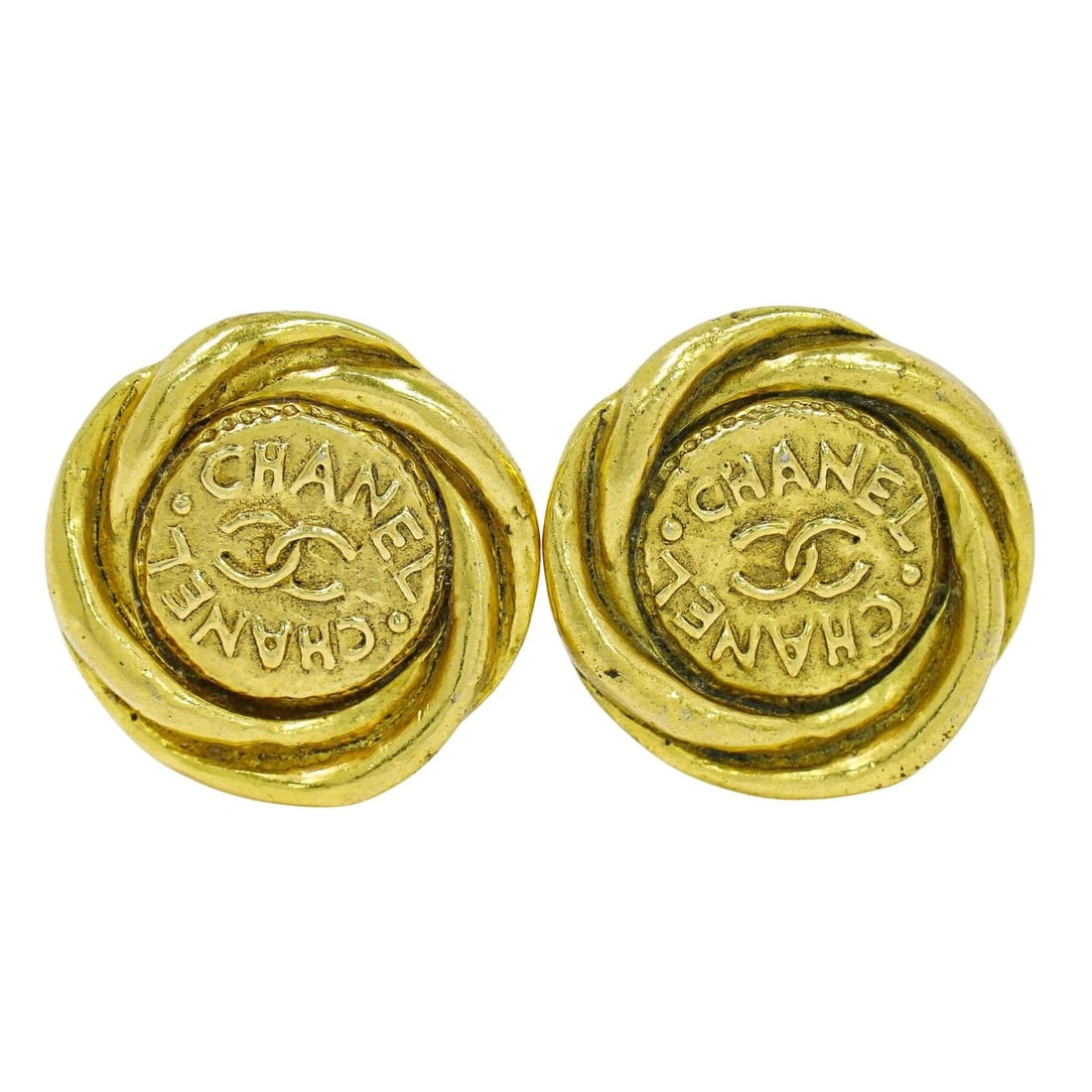 Round Clip-On Earrings with CC Motif by Chanel Vintage Gold Tone: Round Clip-On Earrings with CC Motif by Chanel Vintage Gold Tone These pre-owned Chanel vintage CC round clip-on earrings feature a classic gold tone design. They are designated for female wearers