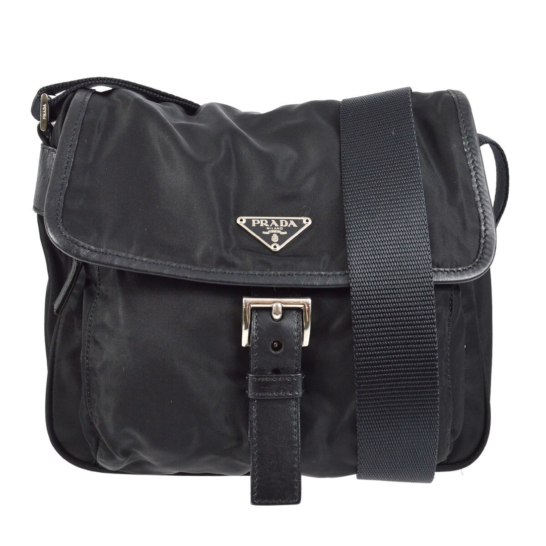 Prada Black Nylon Crossbody Bag with Logo Accent: Prada Black Nylon Crossbody Bag with Logo Accent This Prada Black Nylon Crossbody Bag is a stylish and functional accessory perfect for casual occasions. The bag features a zip closure and is crafted